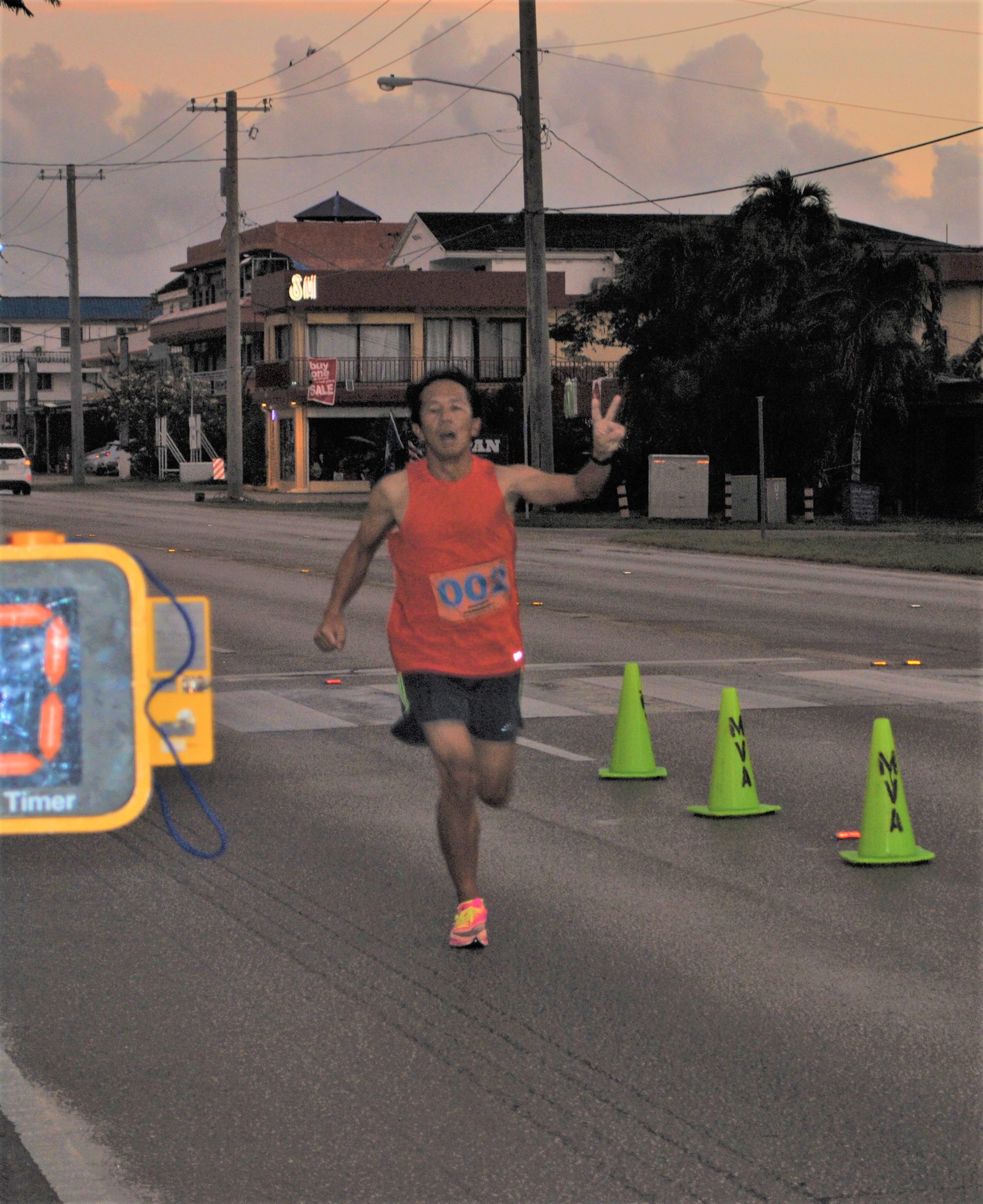 Kosuke Sato celebrates as he reaches the finish line.