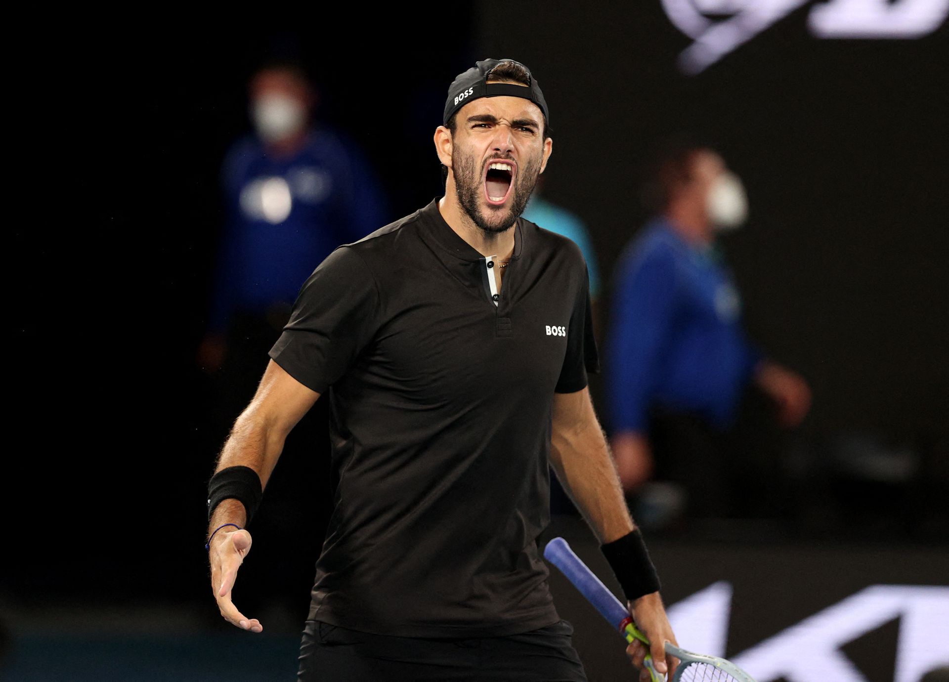 Italy's Matteo Berrettini celebrates winning his quarter-final match against France's Gael Monfils at the Australian Open on Jan. 26, 2022.