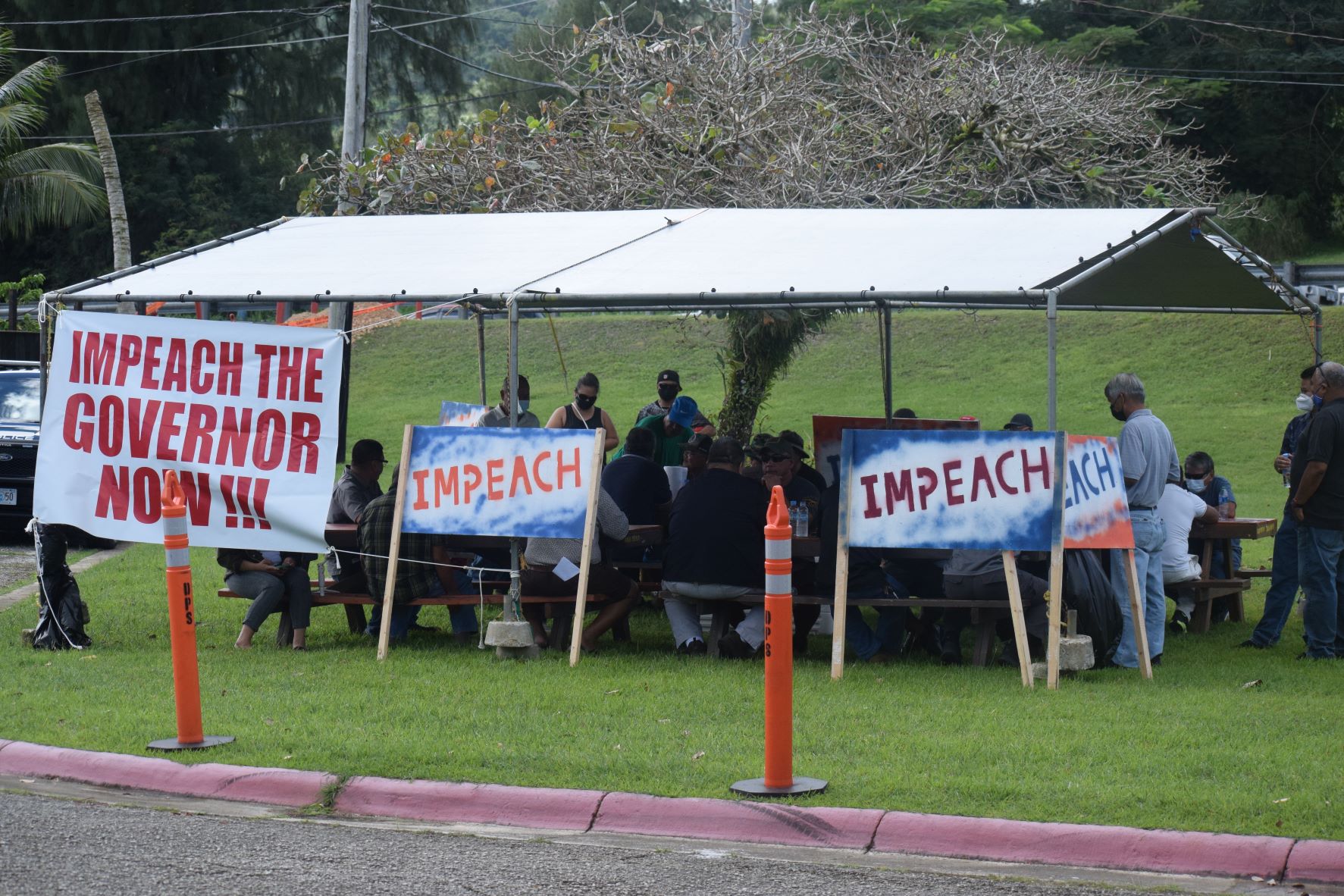 Impeachment supporters gather at a canopy outside the legislative building on Capital Hill.