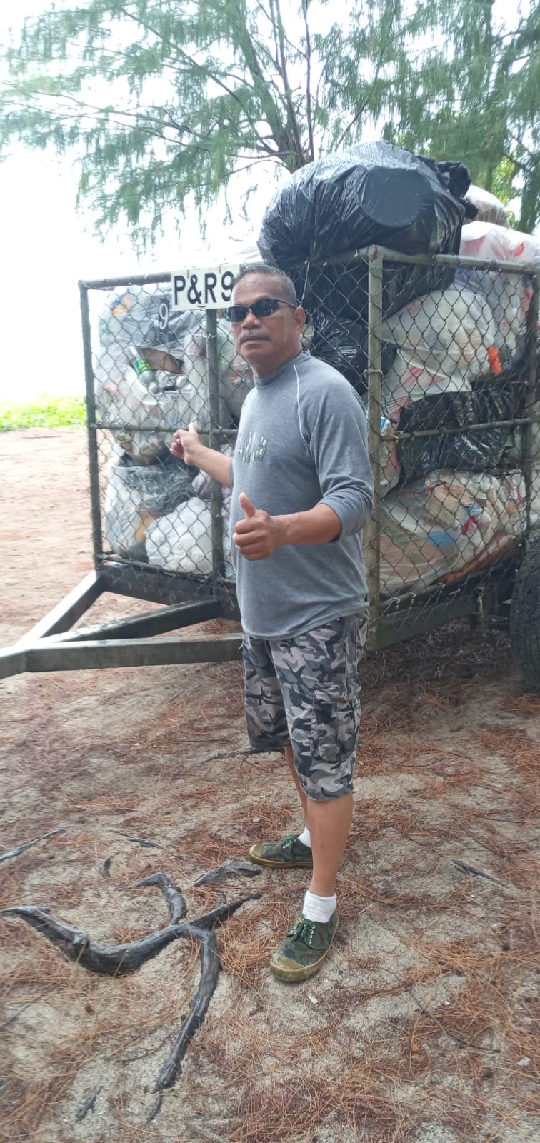 During the holidays, Max Aguon and fellow volunteer Akiki Alexander — not in photo — collected trash from some of the island’s popular beach sites.