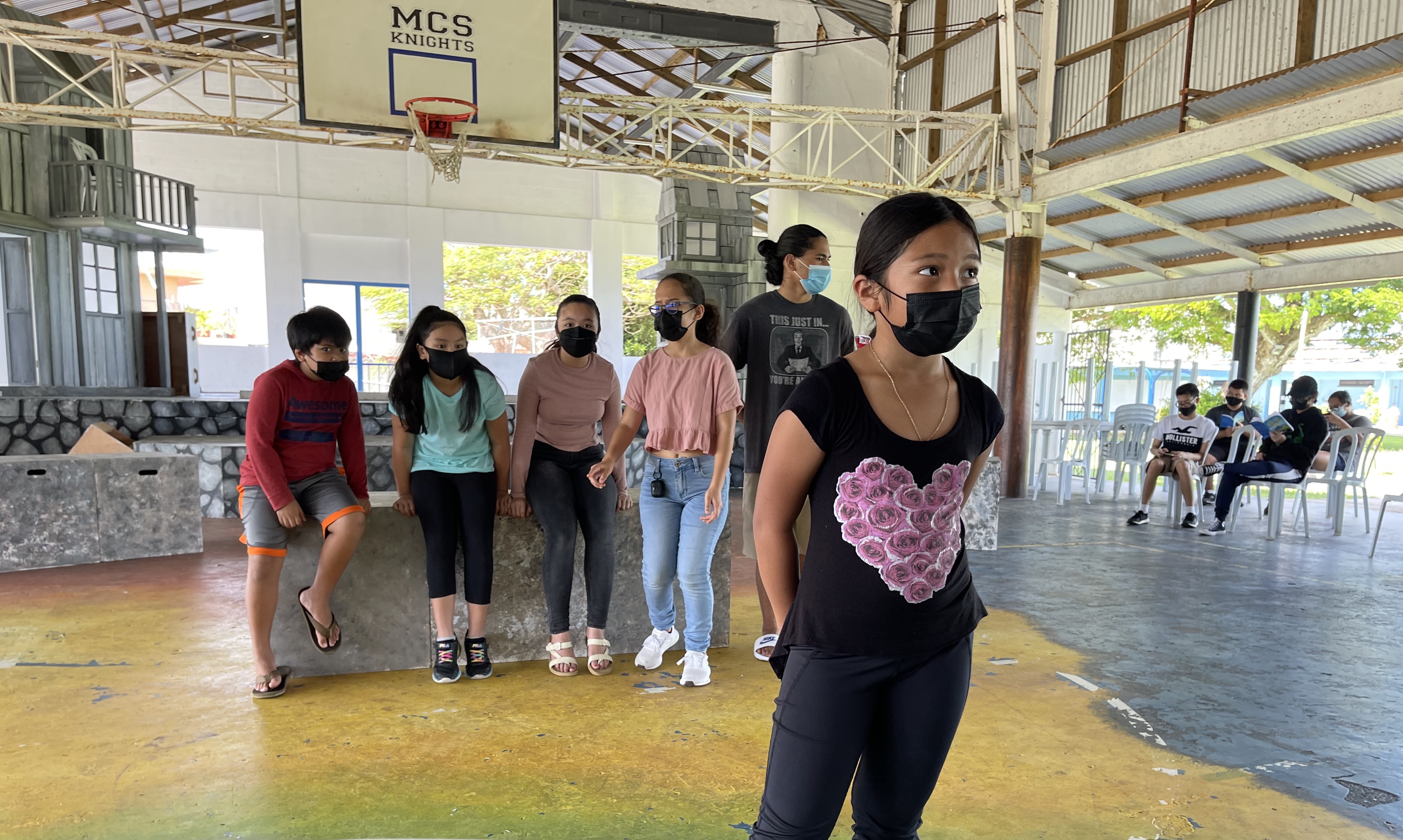 Neia Dolana Duenas Tagabuel, front, who plays Gretl von Trapp in the Mount Carmel School Theatre Club production of “The Sound of Music,” rehearses with fellow cast member in the school’s cafeteria, which provides better air ventilation in order to prevent the transmission of Covid-19. The school has taken such precautionary measures to keep students and the community safe and healthy.