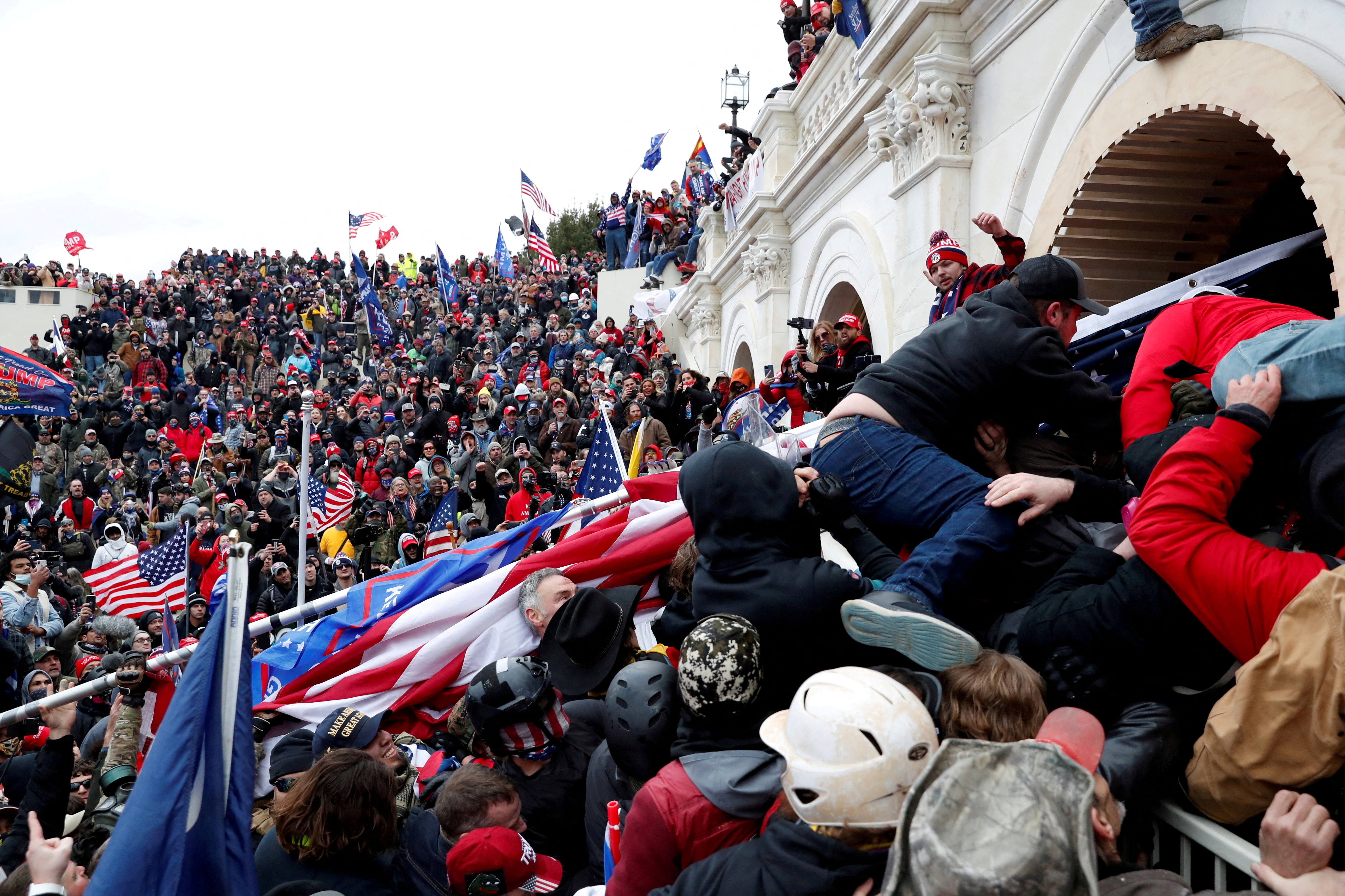 Pro-Trump protesters storm into the U.S. Capitol during a rally to contest the certification of the 2020 U.S. presidential election results by the U.S. Congress, in Washington, D.C, Jan. 6, 2021.