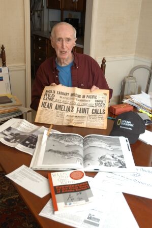 Saipan veteran Robert E. Wallack, whose claim of finding Amelia Earhart's briefcase in a blown safe on Saipan in July 1944 is among the best-known Earhart-on-Saipan testimonies, pauses in his Woodbridge, Connecticut, home during a November 2006 interview. The media friendly Wallack appeared on several national television specials, including "Unsolved Mysteries" and "Eye to Eye with Connie Chung."