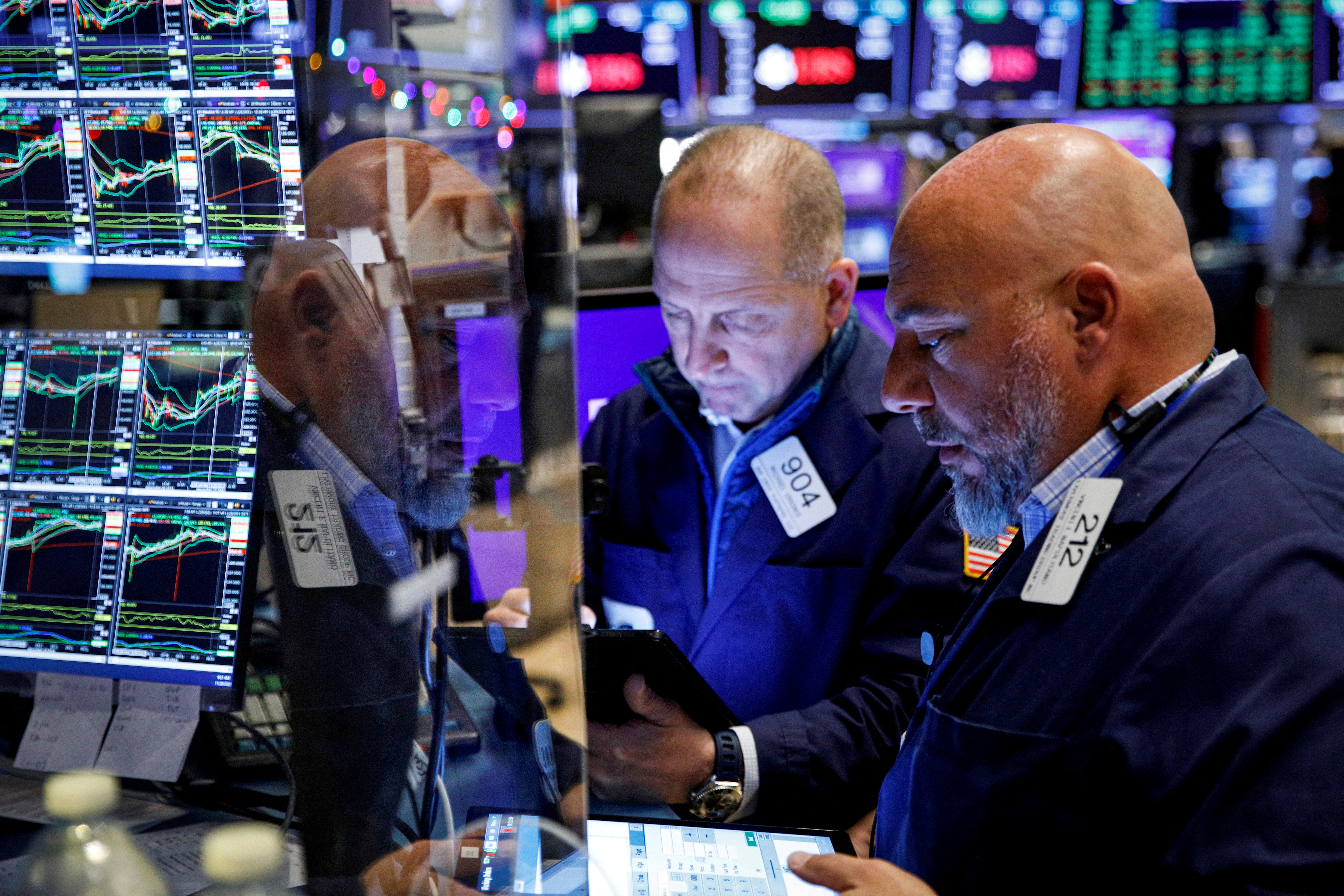 Traders work on the floor of the New York Stock Exchange in New York City, Nov. 29, 2021.