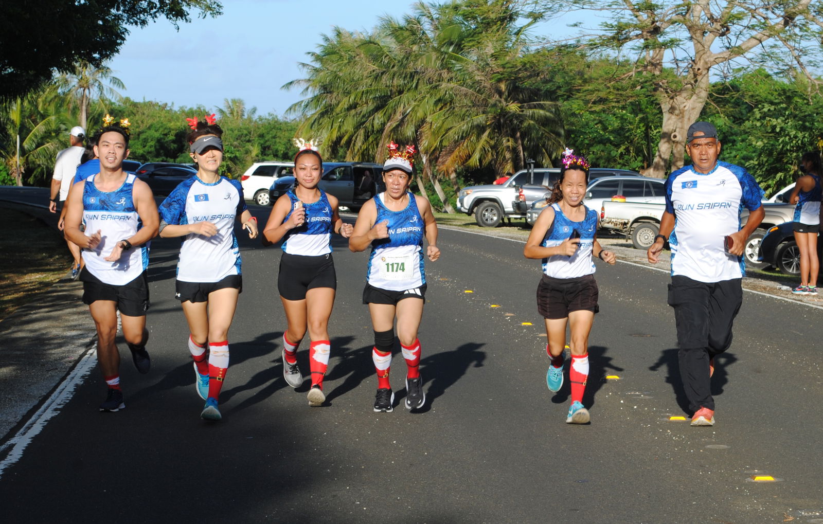 Run Saipan's Fun Run team members cross the finish line of Northern Marianas Athletics’ Christmas Island Relay on Dec. 18, 2021 at the Last Command Post.