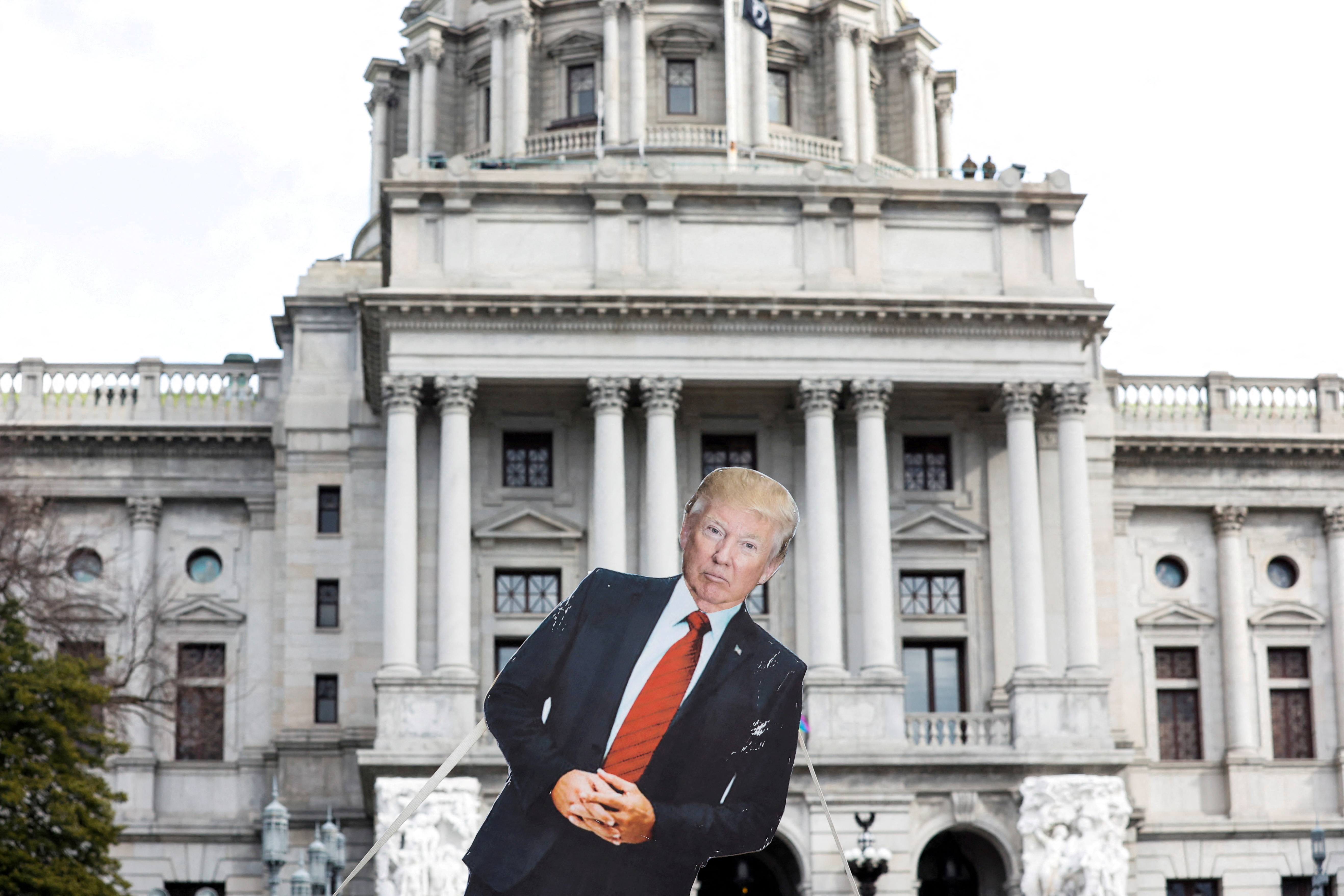 A cardboard cutout depicting  President Donald Trump is seen in front of Pennsylvania State Capitol, as supporters of him are expected to protest against the election of President-elect Joe Biden, outside the Pennsylvania State Capitol in Harrisburg, Pennsylvania, on Jan. 17, 2021.