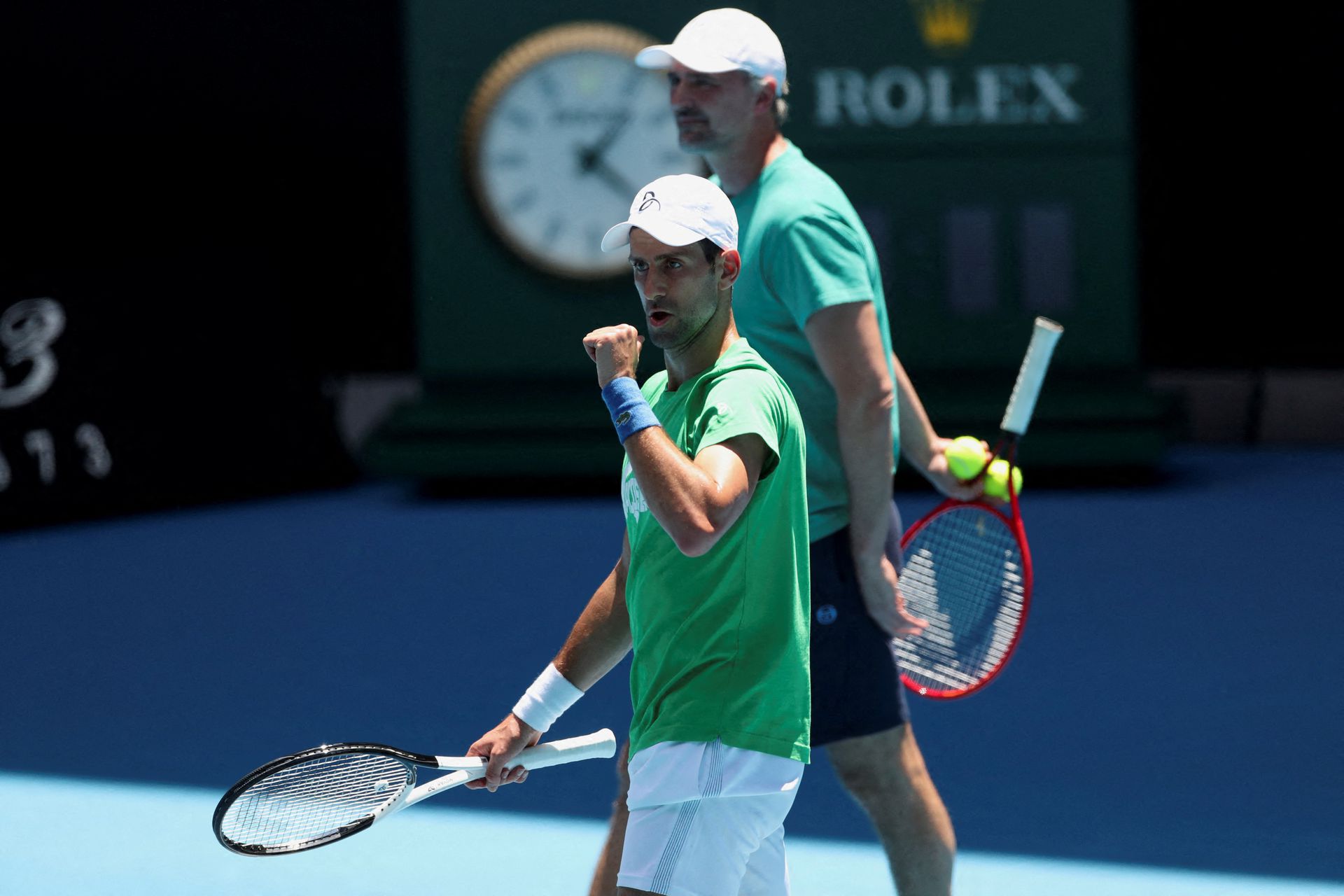 Serbian tennis player Novak Djokovic gestures as he practices at Melbourne Park while questions remain over the legal battle regarding his visa to play in the Australian Open in Melbourne, Australia, Jan. 13, 2022.