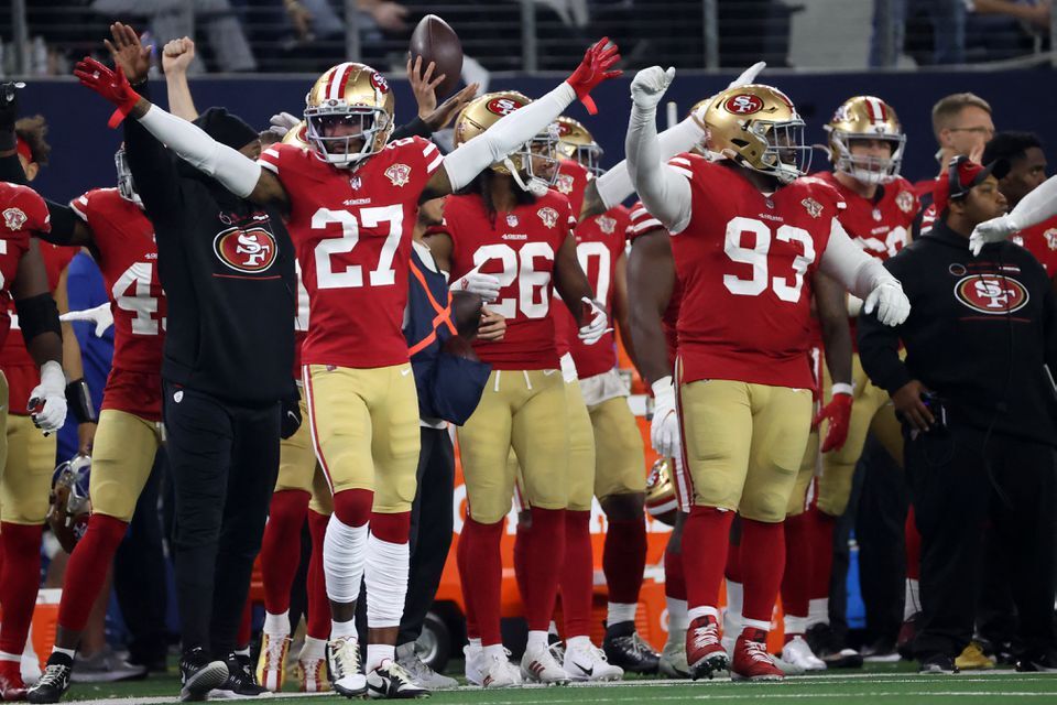 San Francisco 49ers defensive back Dontae Johnson (27) and teammates celebrate on the sidelines during the second half of the NFC Wild Card playoff football game against the Dallas Cowboys at AT&T Stadium in Arlington, Texas on Jan. 16, 2022.