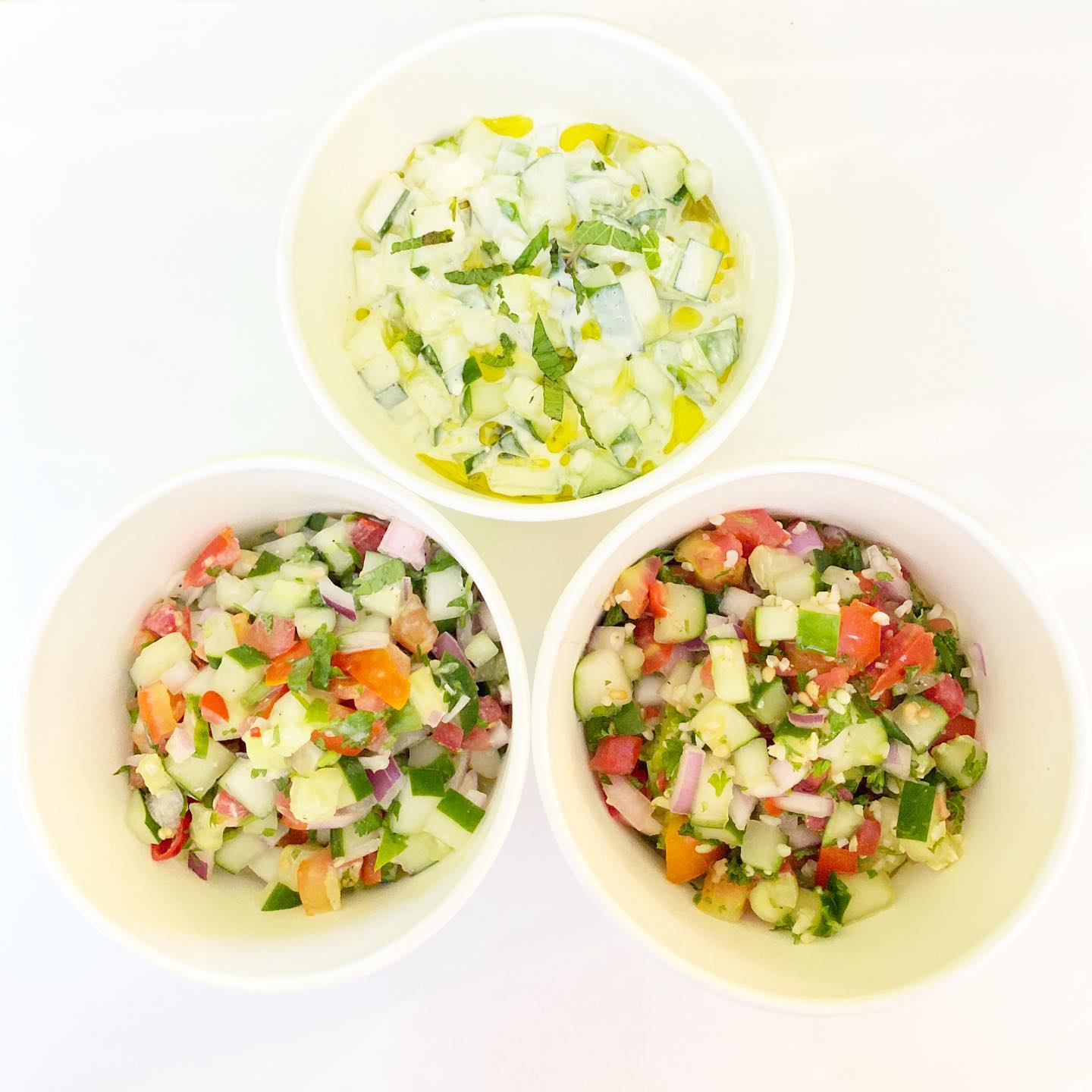 Taboulleh. Tzatziki. Creamy Laban. Caravan’s salads always include a generous amount of herbs, like the refreshing combination of mint and parsley in Taboulleh.