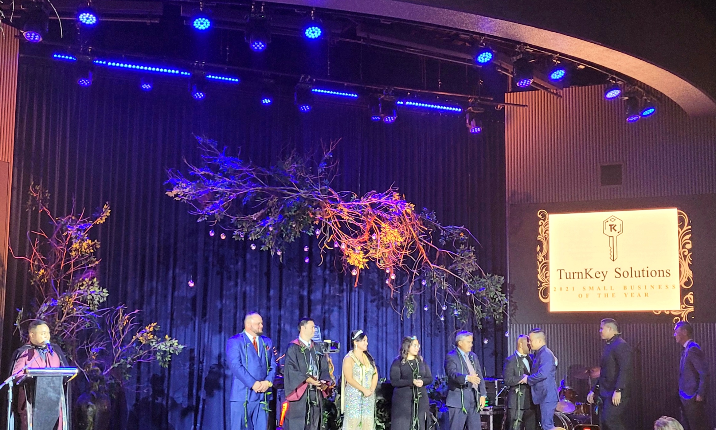 From right, TurnKey Solutions managing partners Jerry Lin, Billy Grow, and Broc Calvo walk onto the stage to accept the Saipan Chamber of Commerce 2021 Small Business of the Year Award.