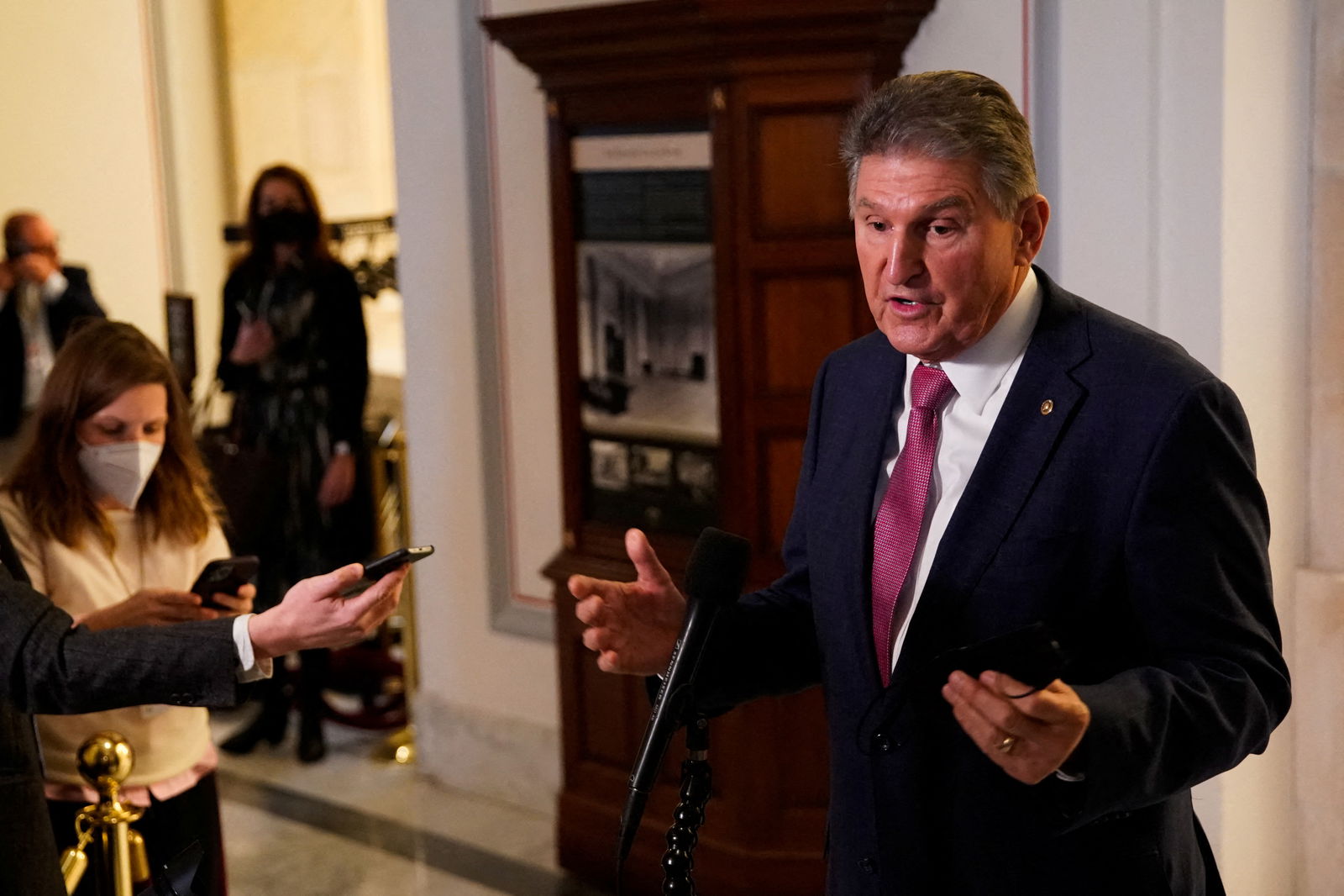 U.S. Sen. Joe Manchin, D-W.V., gestures as he speaks with the media following Senate Democratic lunch, on Capitol Hill in Washington, D.C., Jan. 13, 2022.