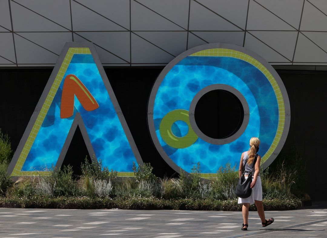 A person walks through Melbourne Park in the lead-up to the Australian Open in Melbourne, Australia, Jan. 12, 2022.