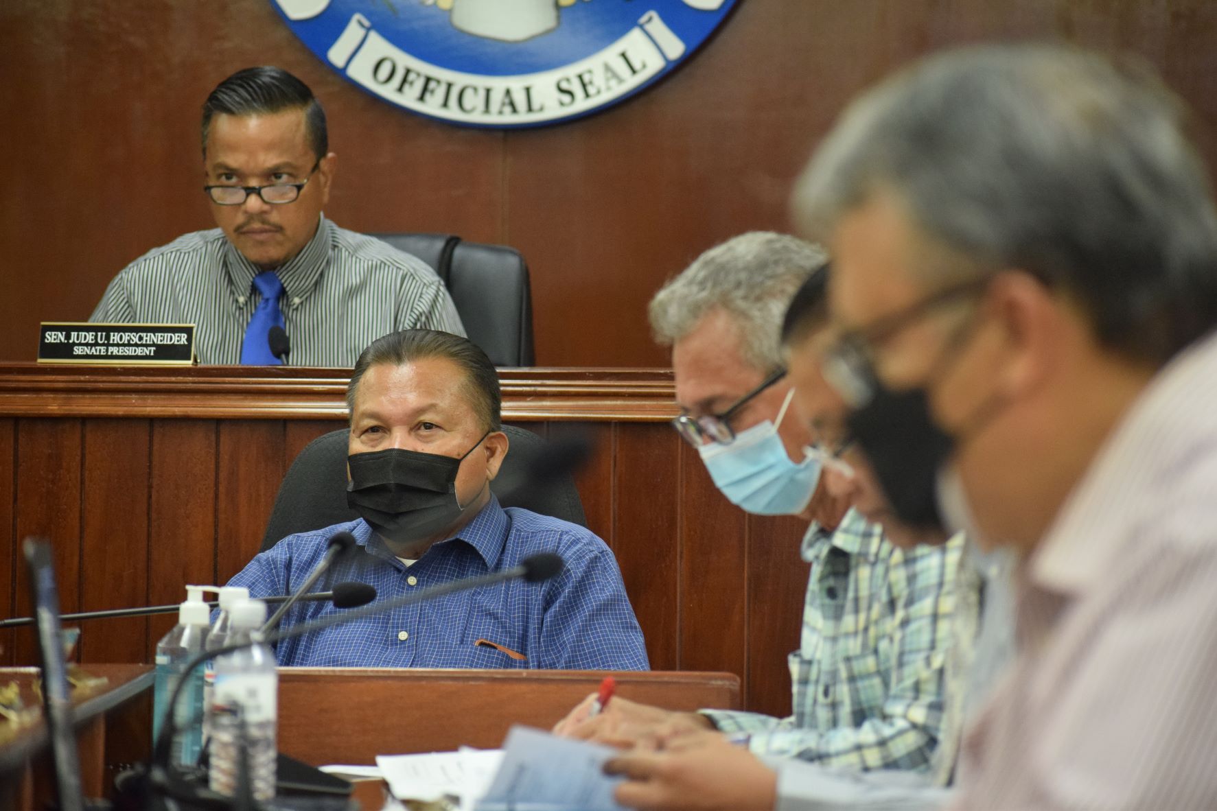 Senate counsel Jose Bermudes, center, and Senate President Jude Hofschneider, left, listen to a community member's testimony during the public comment portion of a Senate session in September. Also in photo are Senate Vice President Justo S. Quitugua, and Sen. Paul A. Manglona. Partly hidden is Sen. Frank Q. Cruz.