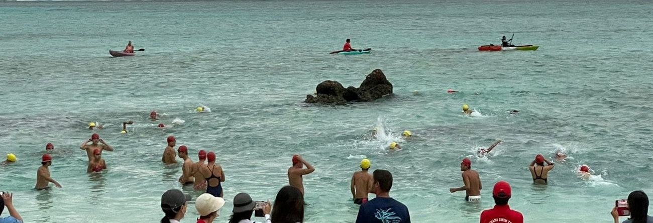 The swimmers push through at the start of the Saipan Swim Club 3K race Saturday at Paupau Beach.