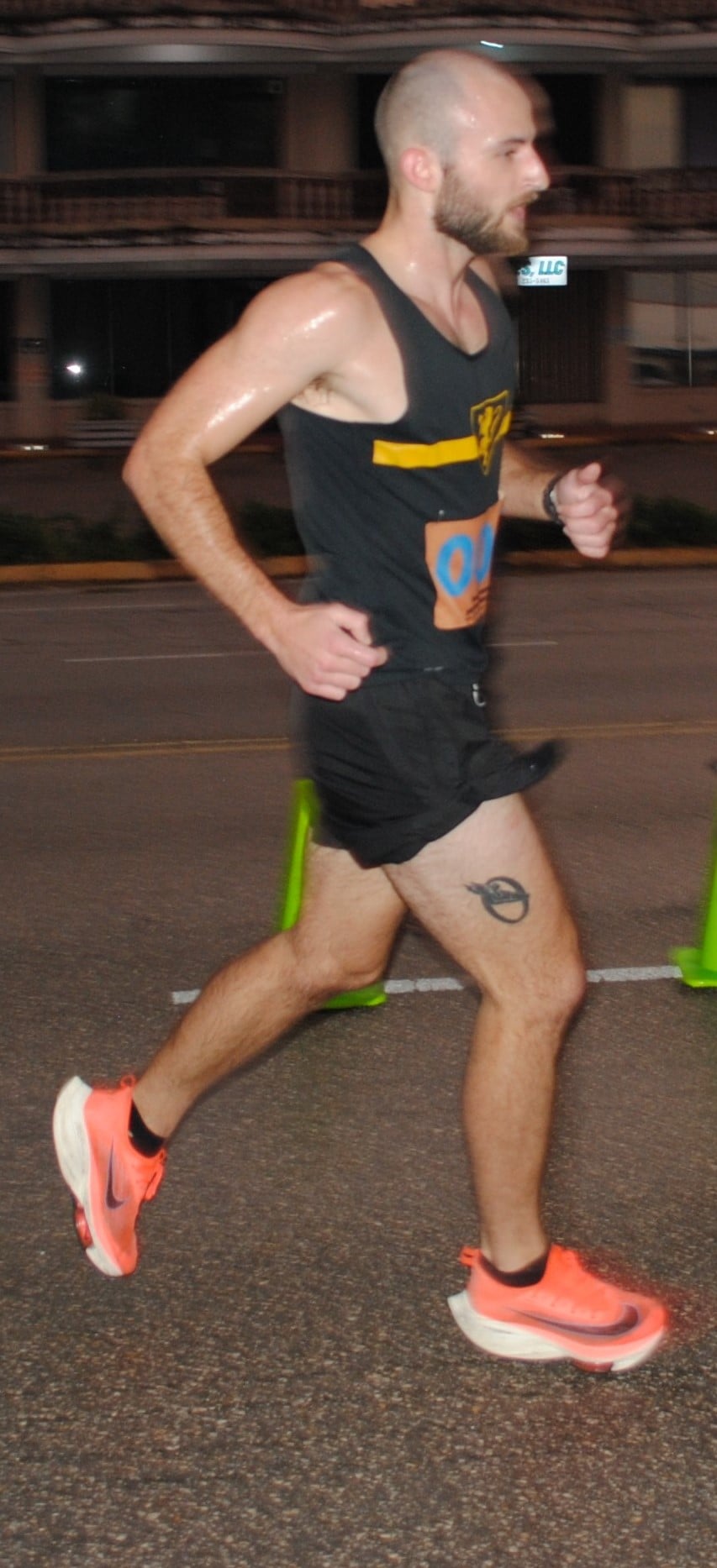 Keith Ketola pushes through the finish line of  Run Saipan’s Run From 2021 race on Beach Road in the Oleai Beach Bar & Grill area.