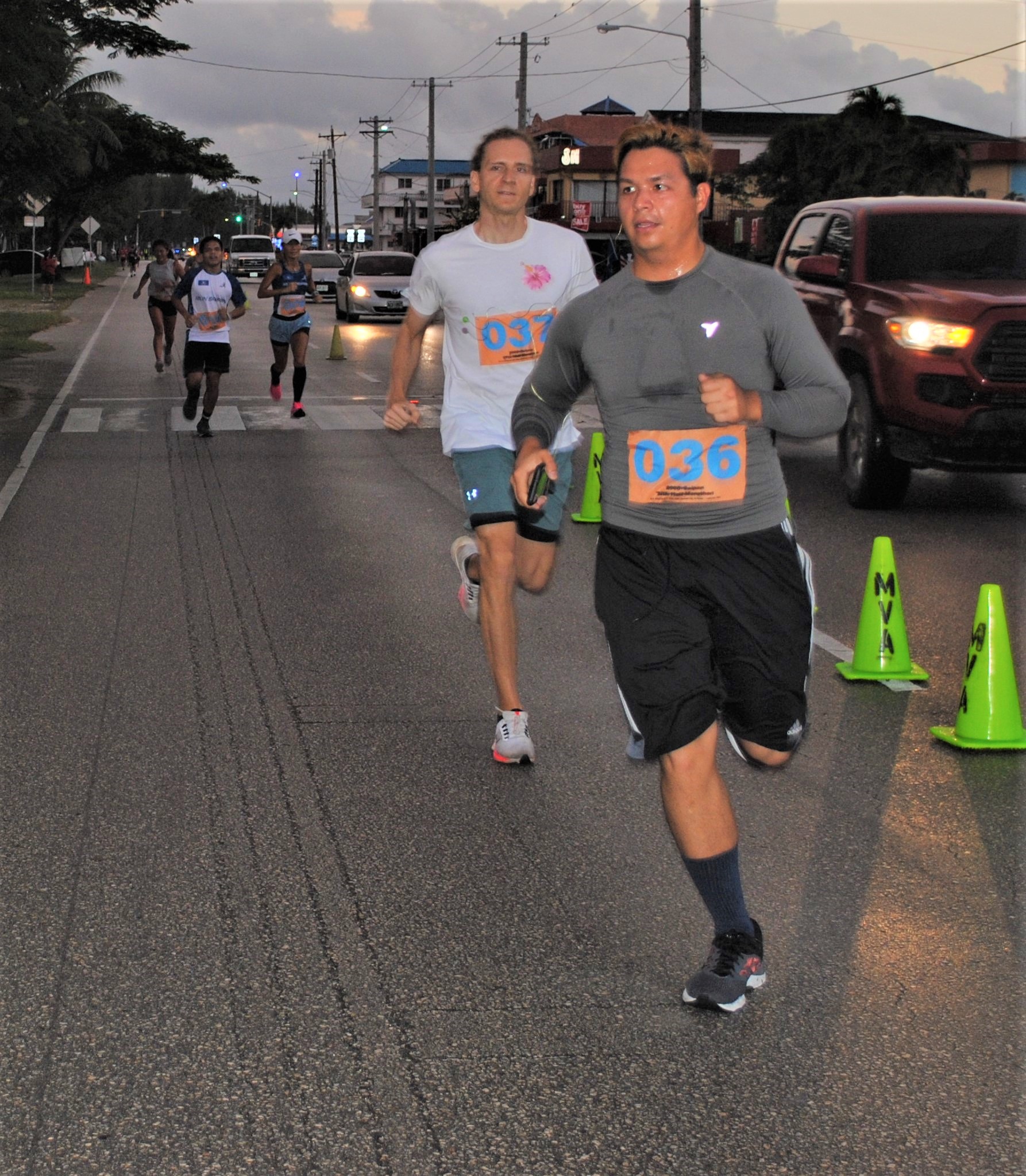 Geza Baka III, foreground, and Aaron Hutchkinson head for the finish line.