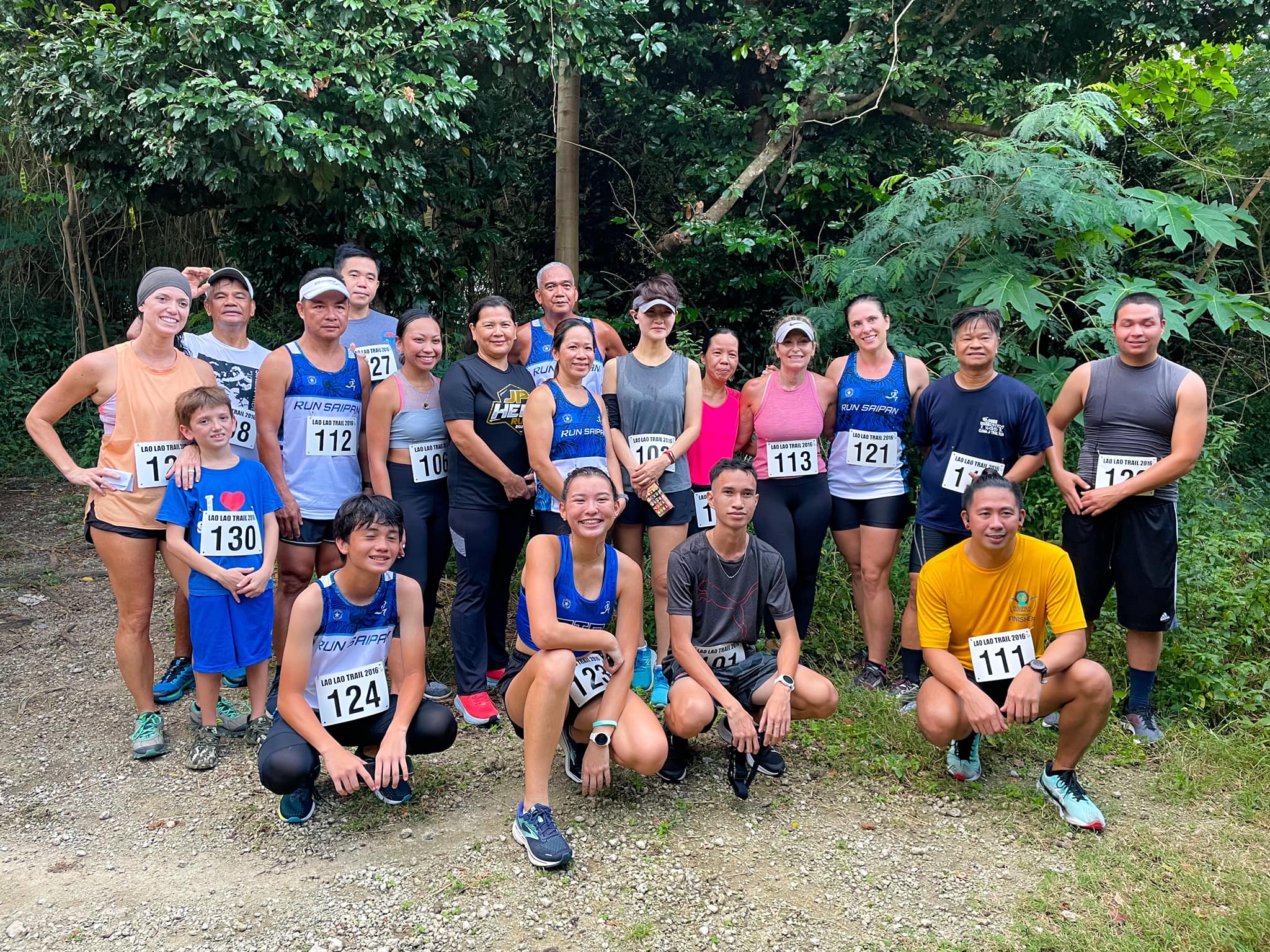The Run Saipan 5K Dash & Splash participants pose for a photo  Saturday at Laolao Bay.
