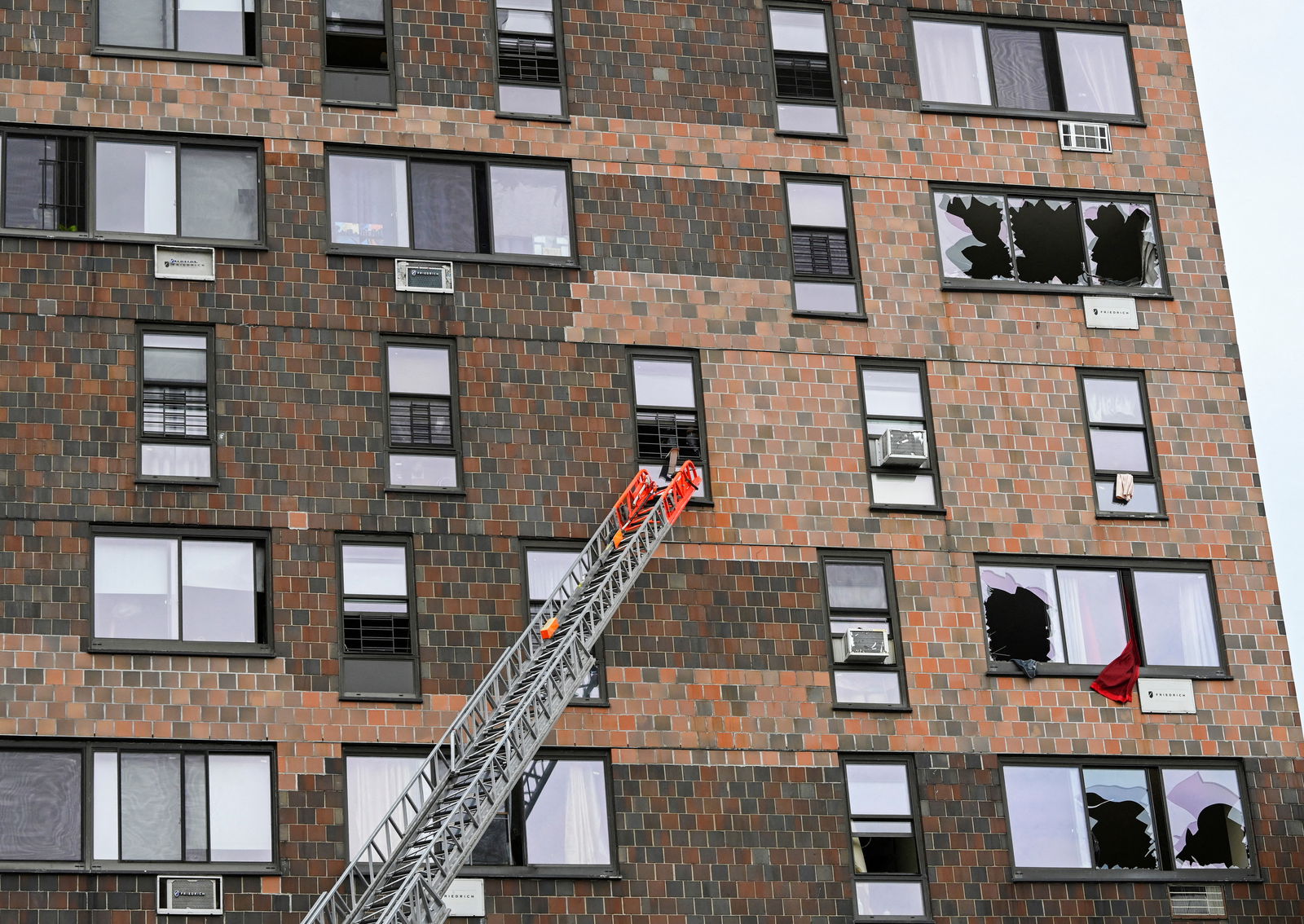 Emergency personnel from the FDNY respond to an apartment building fire in the Bronx borough of New York City, Jan. 9, 2022.