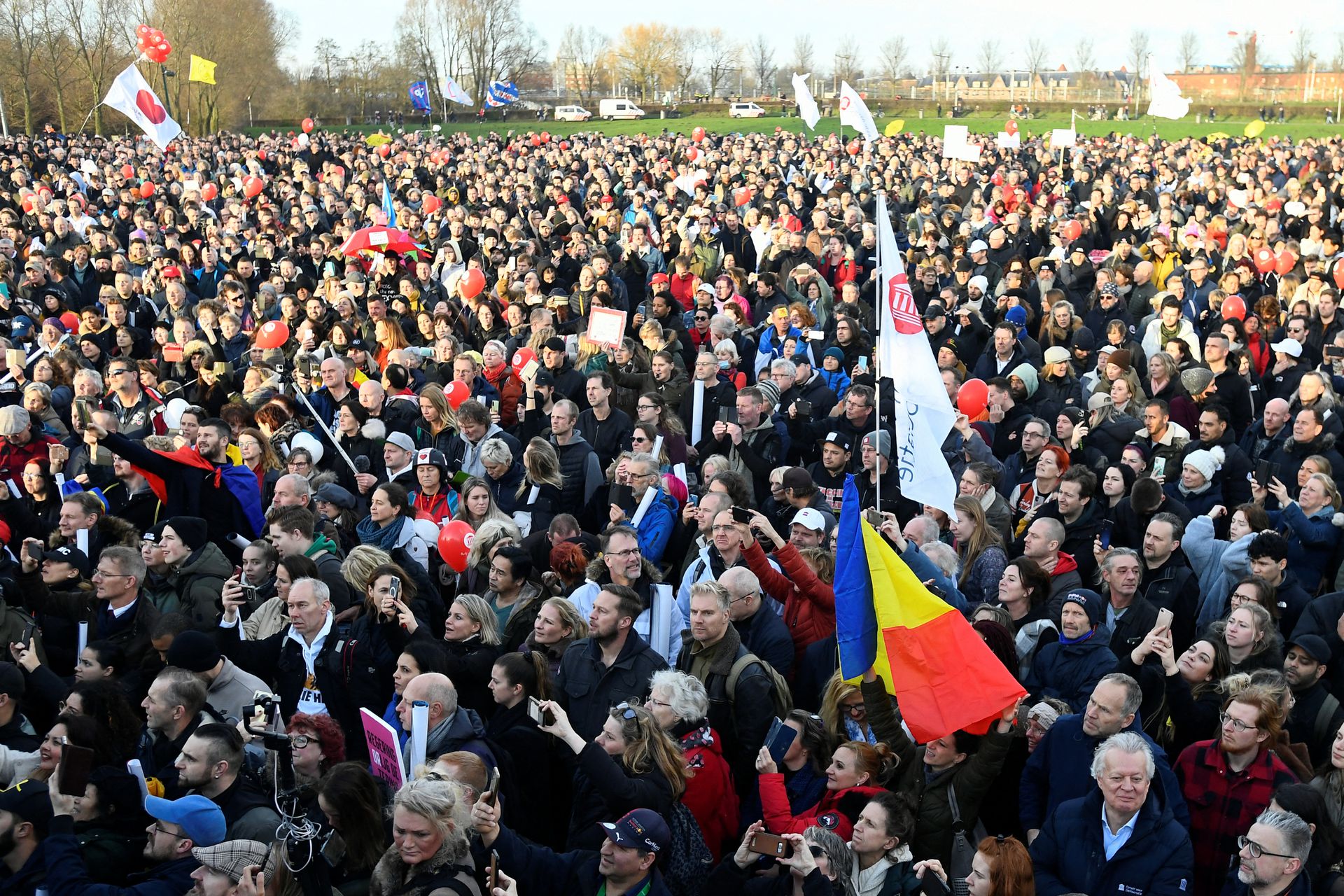 Opponents of restrictions imposed in the Netherlands to contain the spread of Covid-19 protest despite a ban by local authorities, in Amsterdam, Jan. 2, 2022.