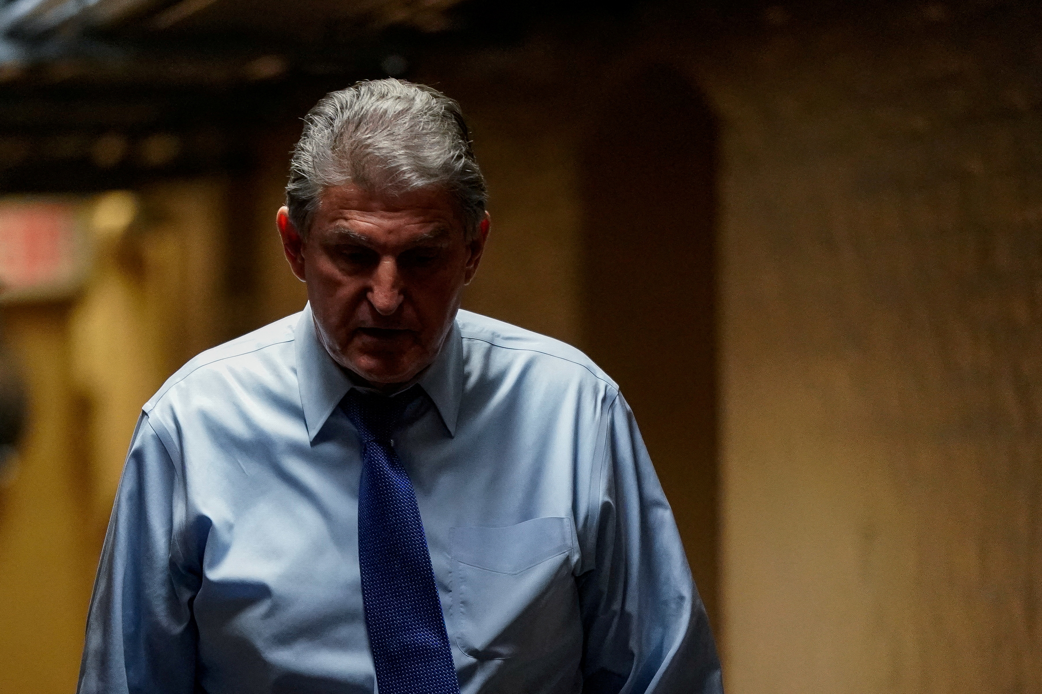 U.S. Sen. Joe Manchin, D-W.V., returns to a basement office meeting with other senators at the U.S. Capitol in Washington, D.C., Dec. 15, 2021.