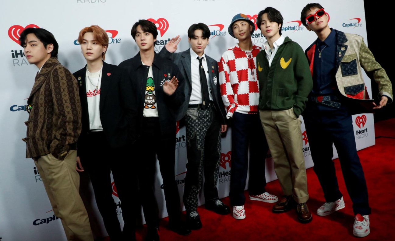 BTS poses at the carpet during arrivals ahead of iHeartRadio Jingle Ball concert at The Forum, in Inglewood, California, Dec. 3, 2021.