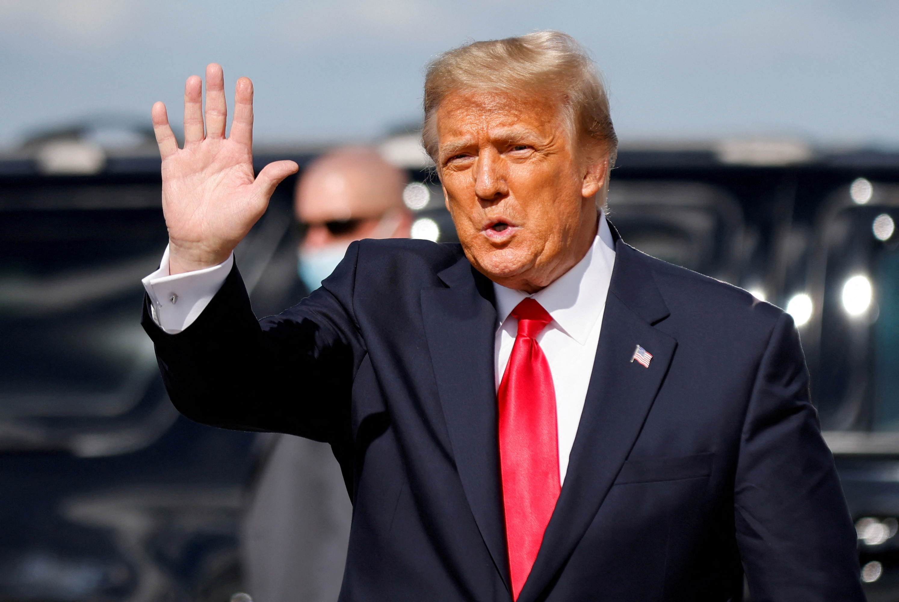 President Donald Trump waves as he arrives at Palm Beach International Airport in West Palm Beach, Florida, Jan. 20, 2021.