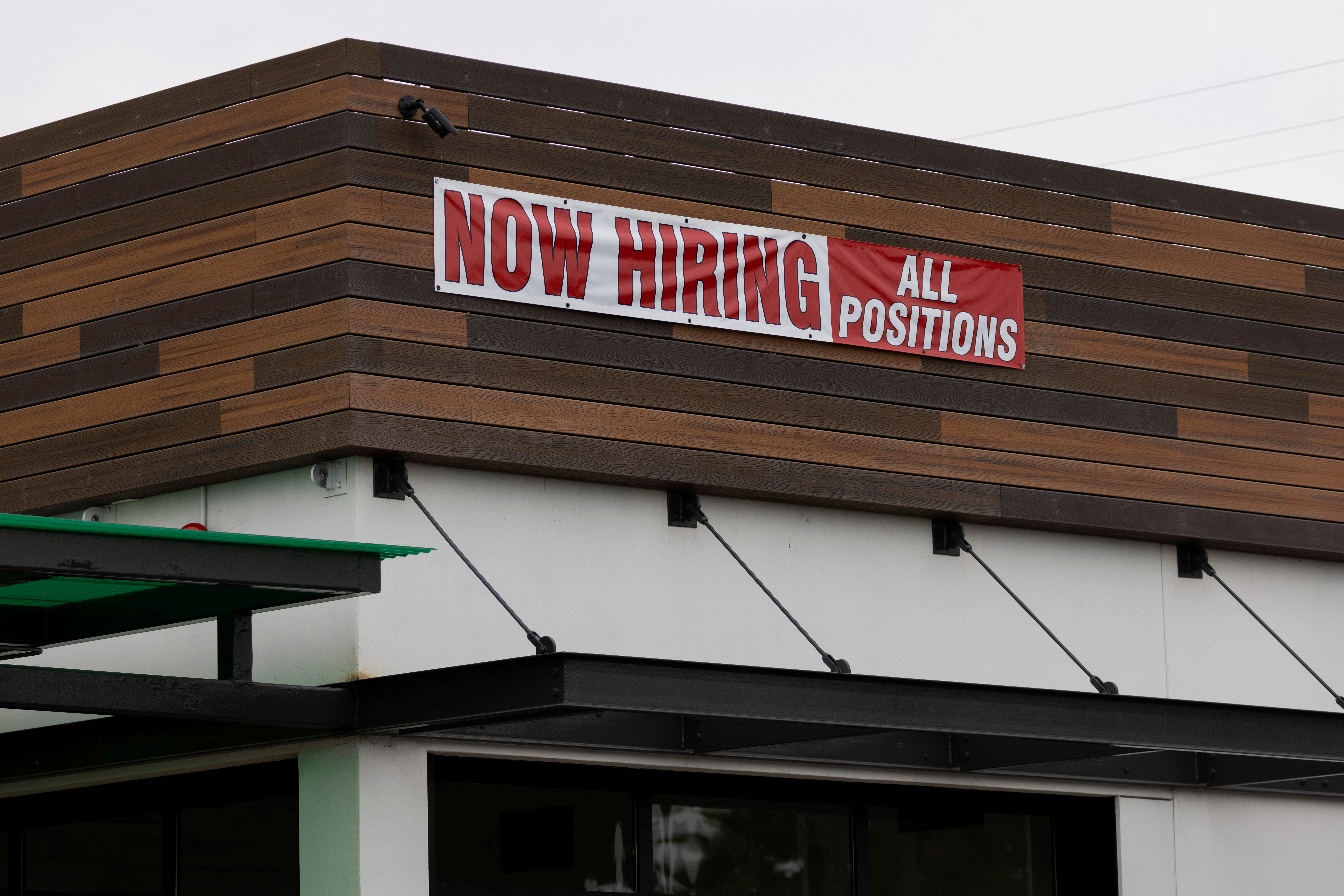 A restaurant advertising jobs looks to attract workers in Oceanside, California on May 10, 2021.