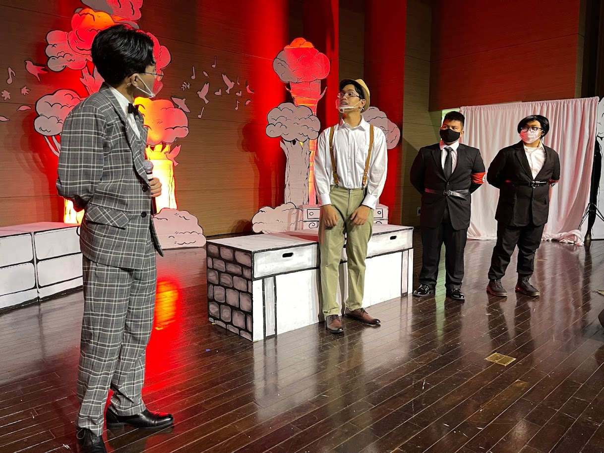 Captain von Trapp resists the efforts of members of the Nazi regime, played by Matthew Sablan and Carlo Diaz.