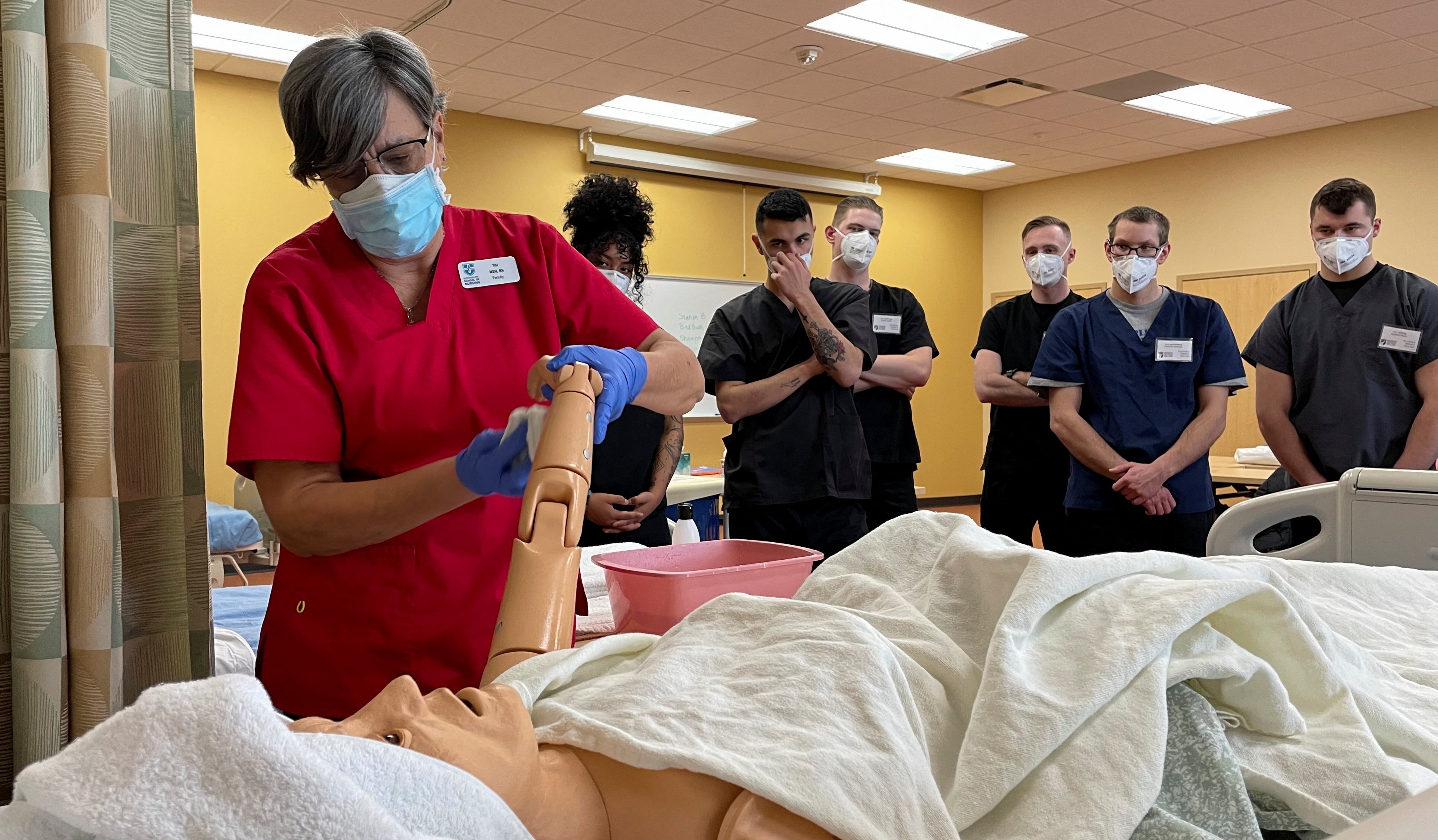National Guard members participate in a course to become certified nursing assistants at Madison Area Technical College in Madison, Wisconsin, Feb. 18, 2022.