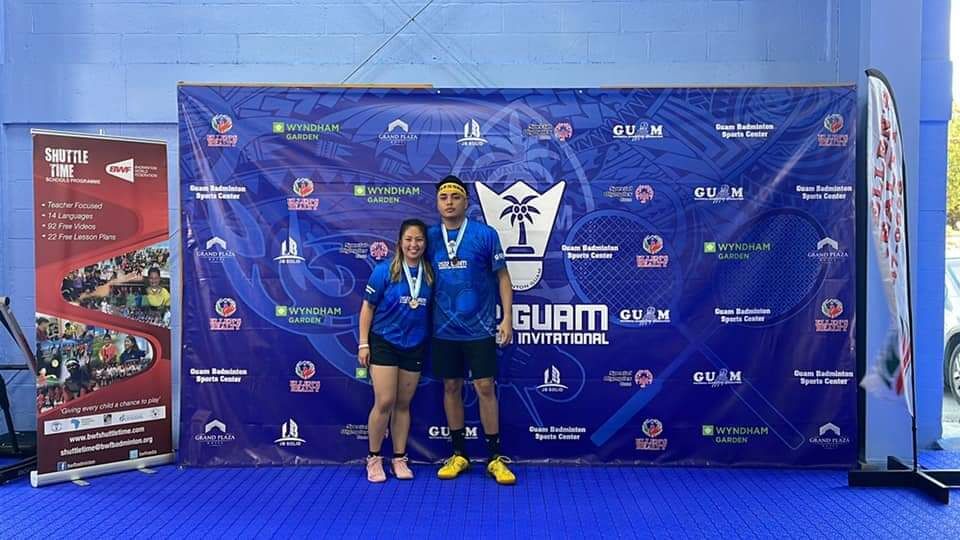 The CNMI’s Janelle Pangilinan and Nate Guerrero pose with their gold medals at the 2022 Guam Badminton Invitational Tournament.