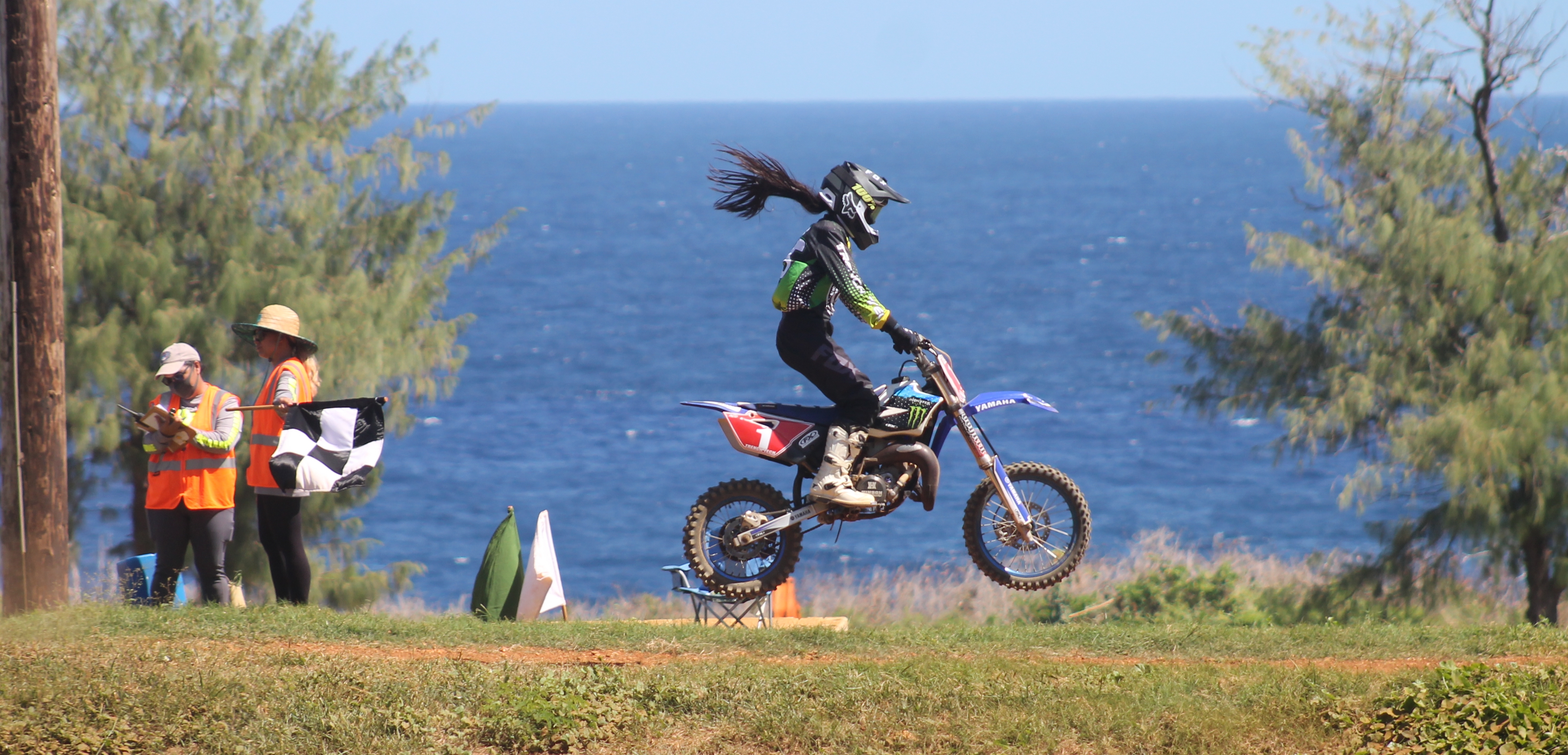 Nanako Celis crosses the finish line of the Power Puff Girls race Sunday at Cow Town Raceway Park.