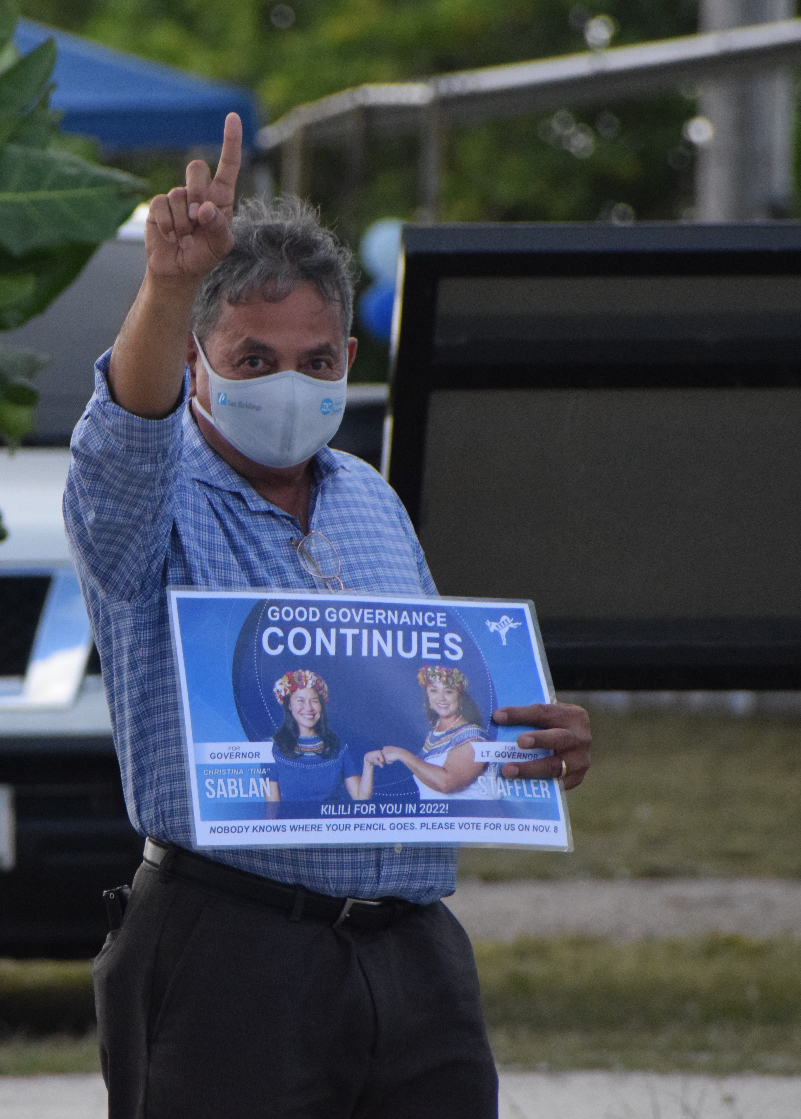 Rep. Richard T. Lizama gestures during a roadside waving activity last month in support of the Democratic Party’s candidate for governor, Rep. Tina Sablan, and her running mate, Rep. Leila Staffler, at Garapan Fishing Base.