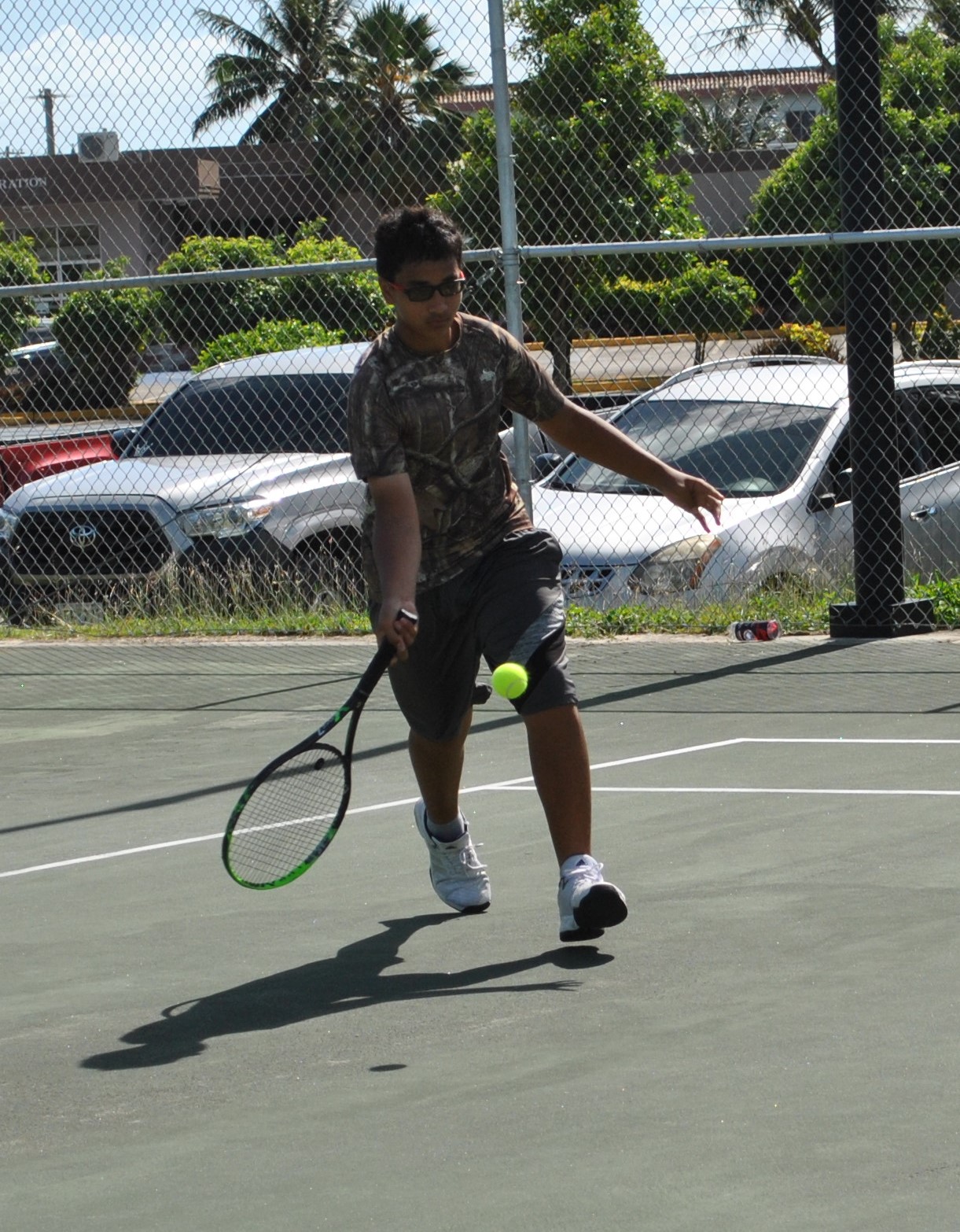 Nason Wessel reaches for the return during a 2021 White-Coconut Classic tennis match at American Memorial Park.