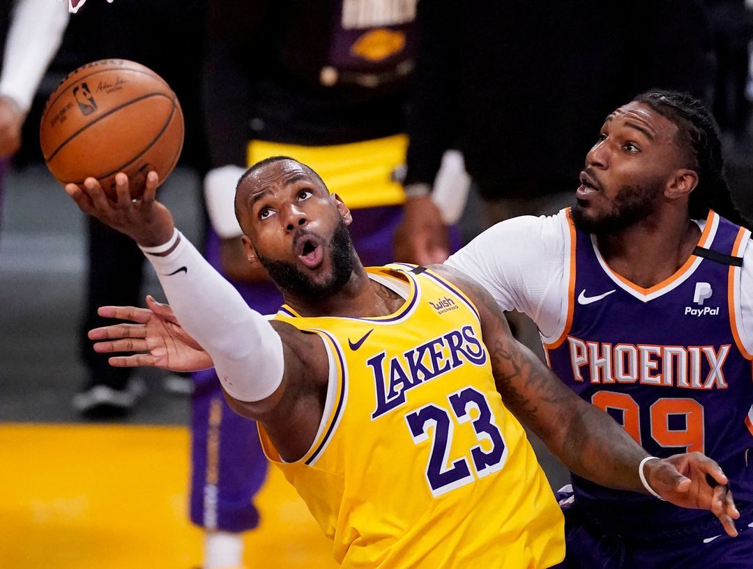 Los Angeles Lakers forward LeBron James (23) drives to the basket past Phoenix Suns forward Jae Crowder (99) during the fourth quarter of game three in the first round of the 2021 NBA Playoffs at Staples Center in Los Angeles, California on May 27, 2021.