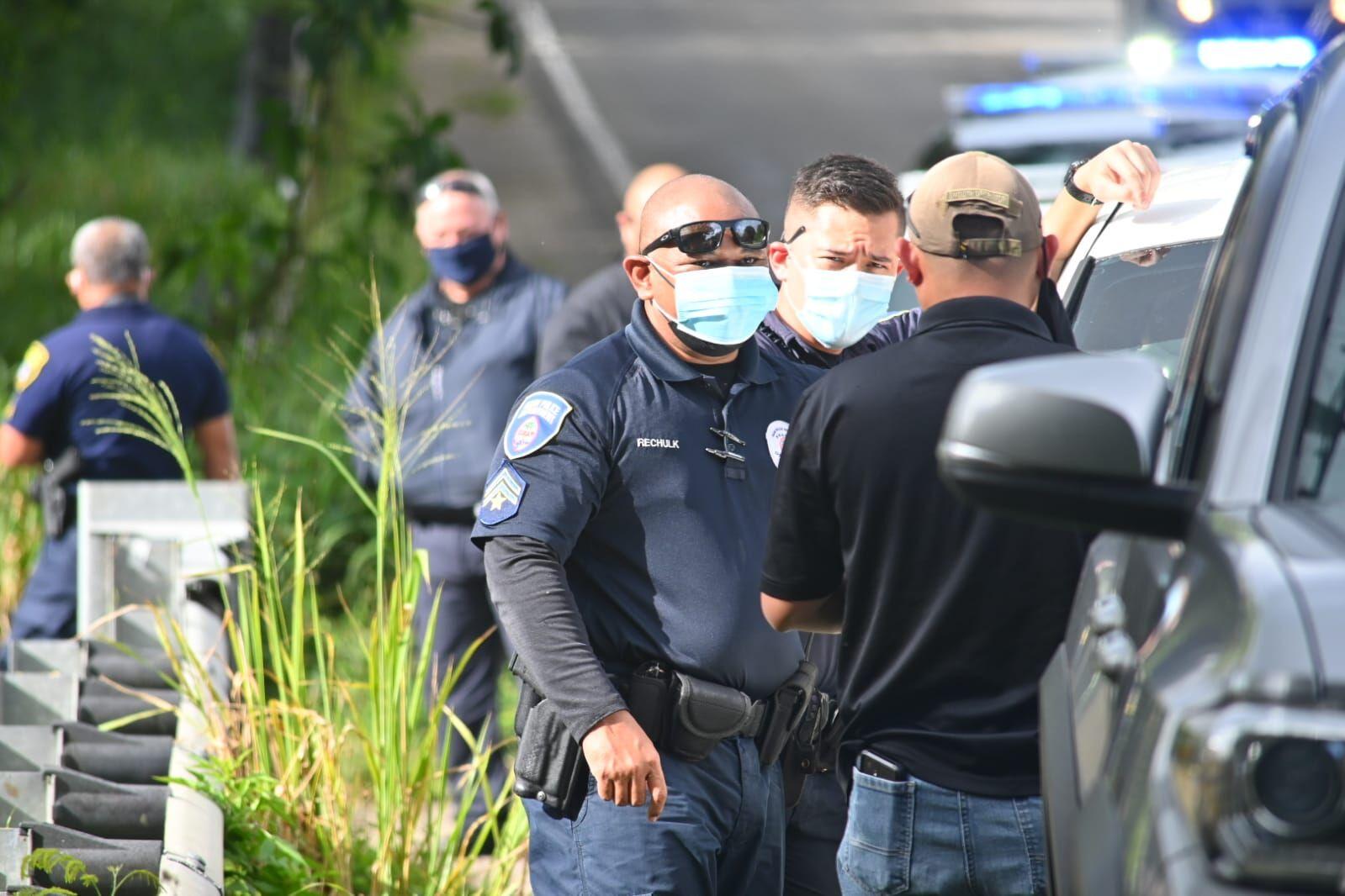 Officers with the Guam Police Department arrive at the site of a trash fire in Chalan Pago off Route 10 on Saturday, Jan. 29, 2022. They were called by the Guam Fire Department after possible human remains were found after the fire was extinguished.
