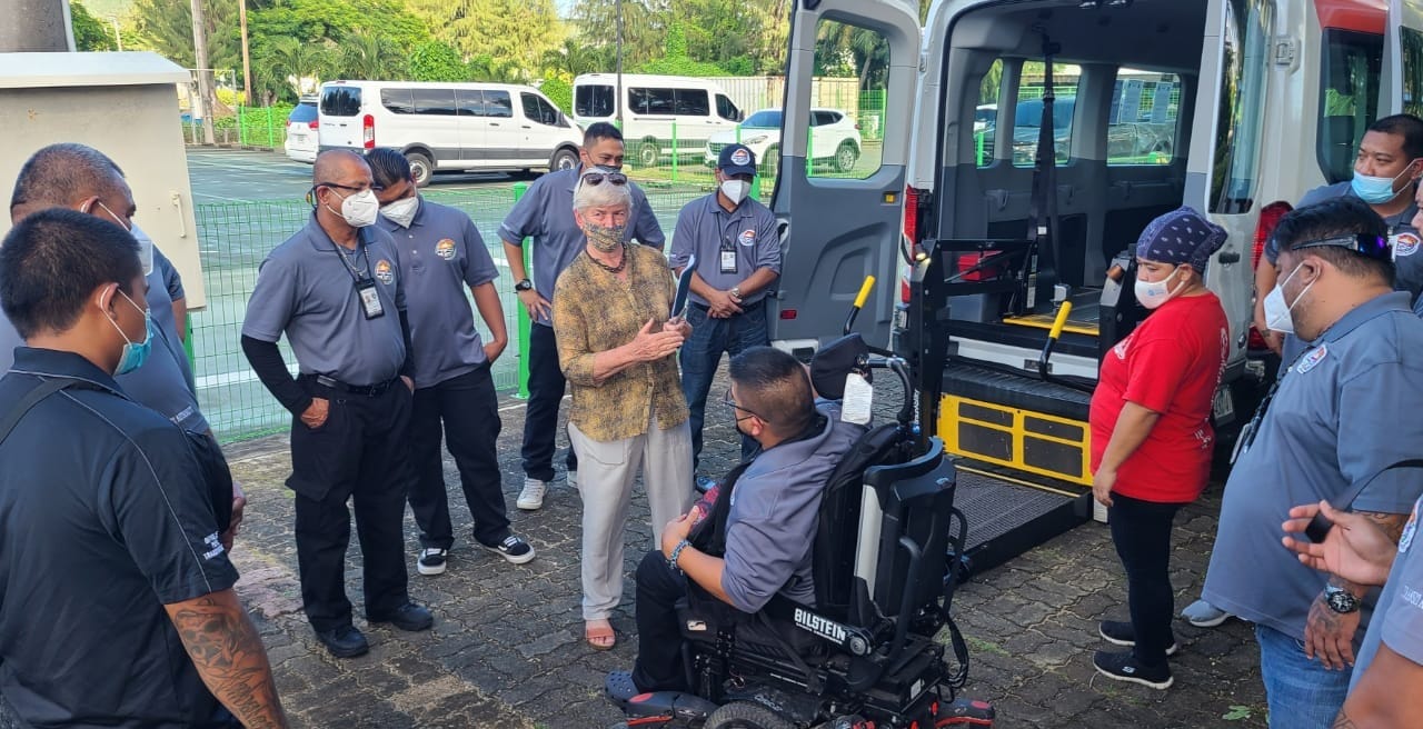 Master trainer Ginger Porter M.Ed. conducts the PASS hands- on wheelchair safety securement test with COTA transit operators