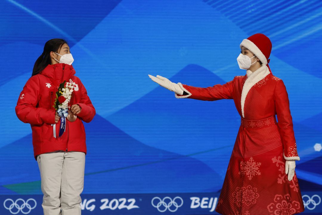 Bronze medalist Kaori Sakamoto of Japan celebrates on the podium at the Beijing Medals Plaza, Beijing, China on Feb. 18, 2022.