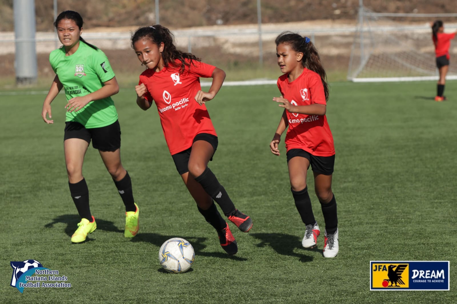 Paire Football Club 2’s Beatrice Gross pushes the ball forward during a JFA/NMIFA All School Festival game Saturday at the NMI Soccer Training Center.