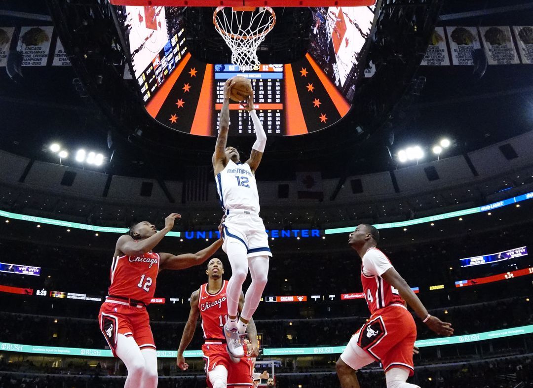 Chicago Bulls guard Ayo Dosunmu (12) defends Memphis Grizzlies guard Ja Morant (12) during the second half at United Center in Chicago, Illinois on Feb. 26, 2022.