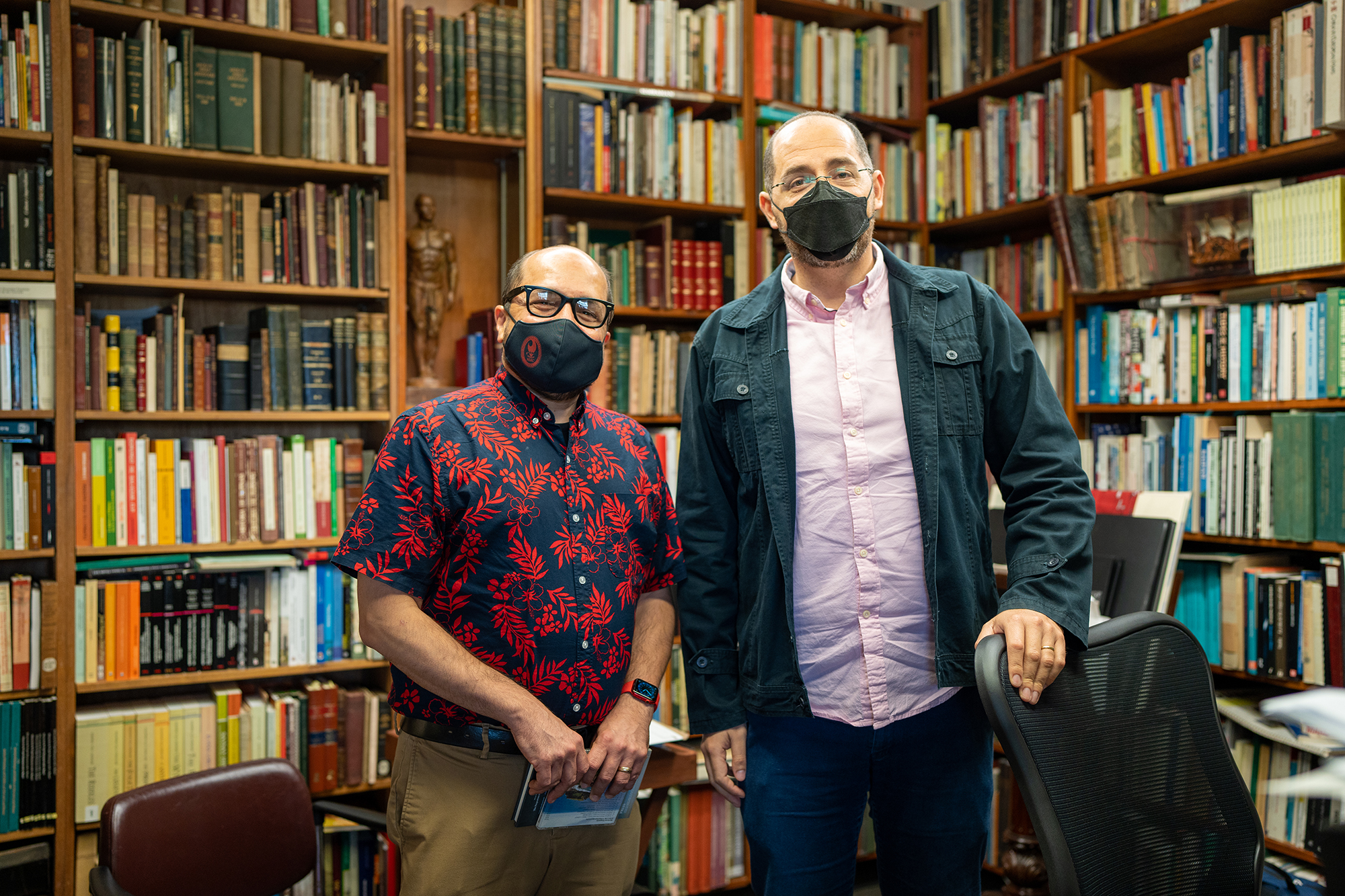 Northern Marianas College President Galvin Deleon Guerrero, left, tours the UOG Press and Micronesian Area Research Center at the University of Guam on Feb. 1 with MARC Director of Research Carlos Madrid. During the visit, the two schools formalized an agreement to create an NMC division of UOG Press that will publish peer-reviewed works about the Northern Mariana Islands and/or by authors from the island chain.