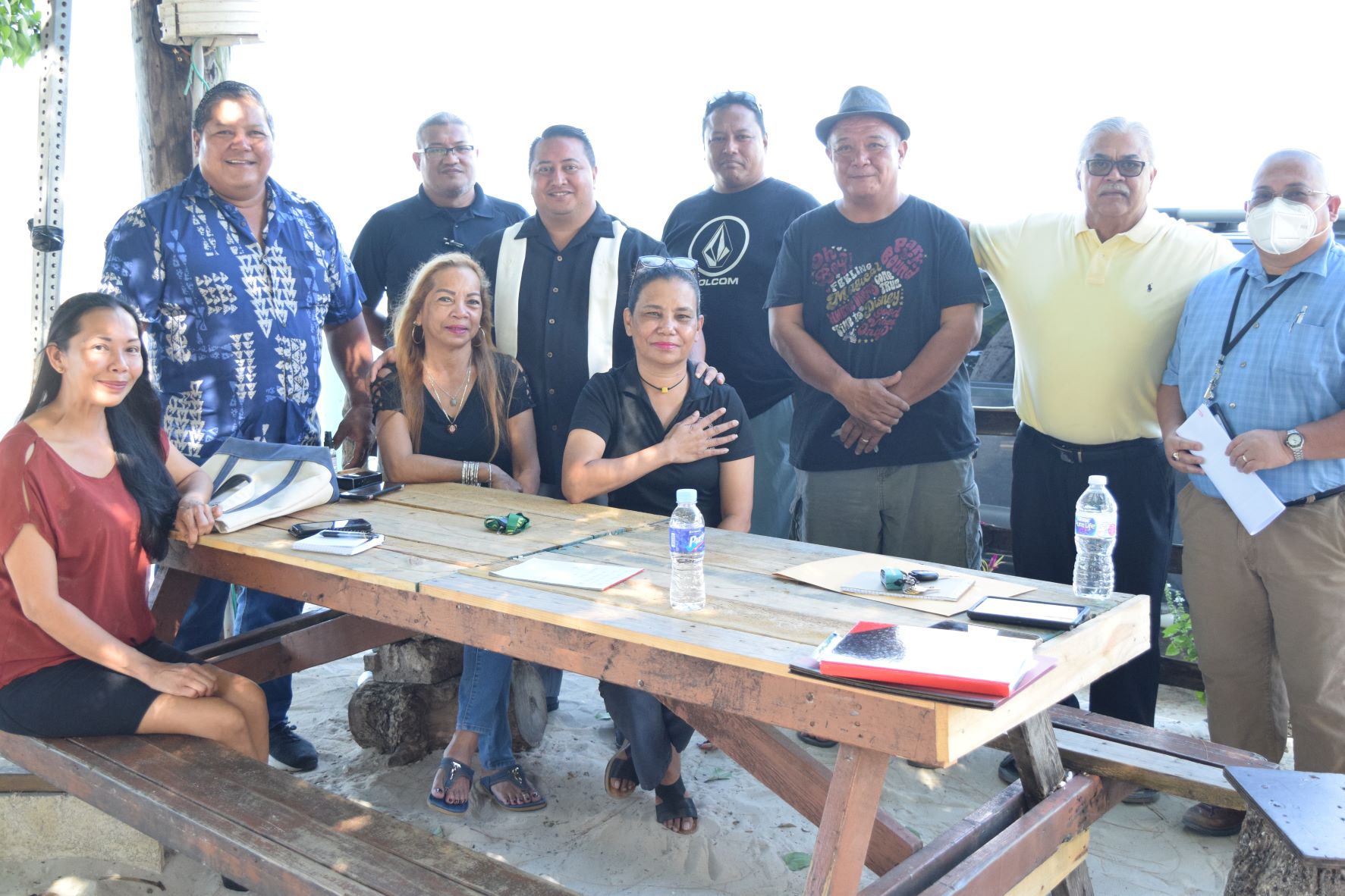 Gov. Ralph DLG Torres, third left standing, Department of Lands and Natural Resources Secretary Anthony Benavente, left, and Infrastructure and Recovery Program civil engineer, Mariano Iglesias, right, join Bantalan Sugar Dock Inc. President Ramon Cabrera, third right, and other officers during meeting at Sugar Dock in Chalan Kanoa on Thursday.
