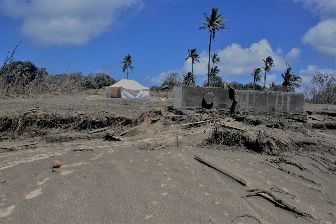 A general view shows damaged buildings and landscape covered with ash following the volcanic eruption and tsunami in Kanokupolu, Tonga, Jan. 23, 2022.