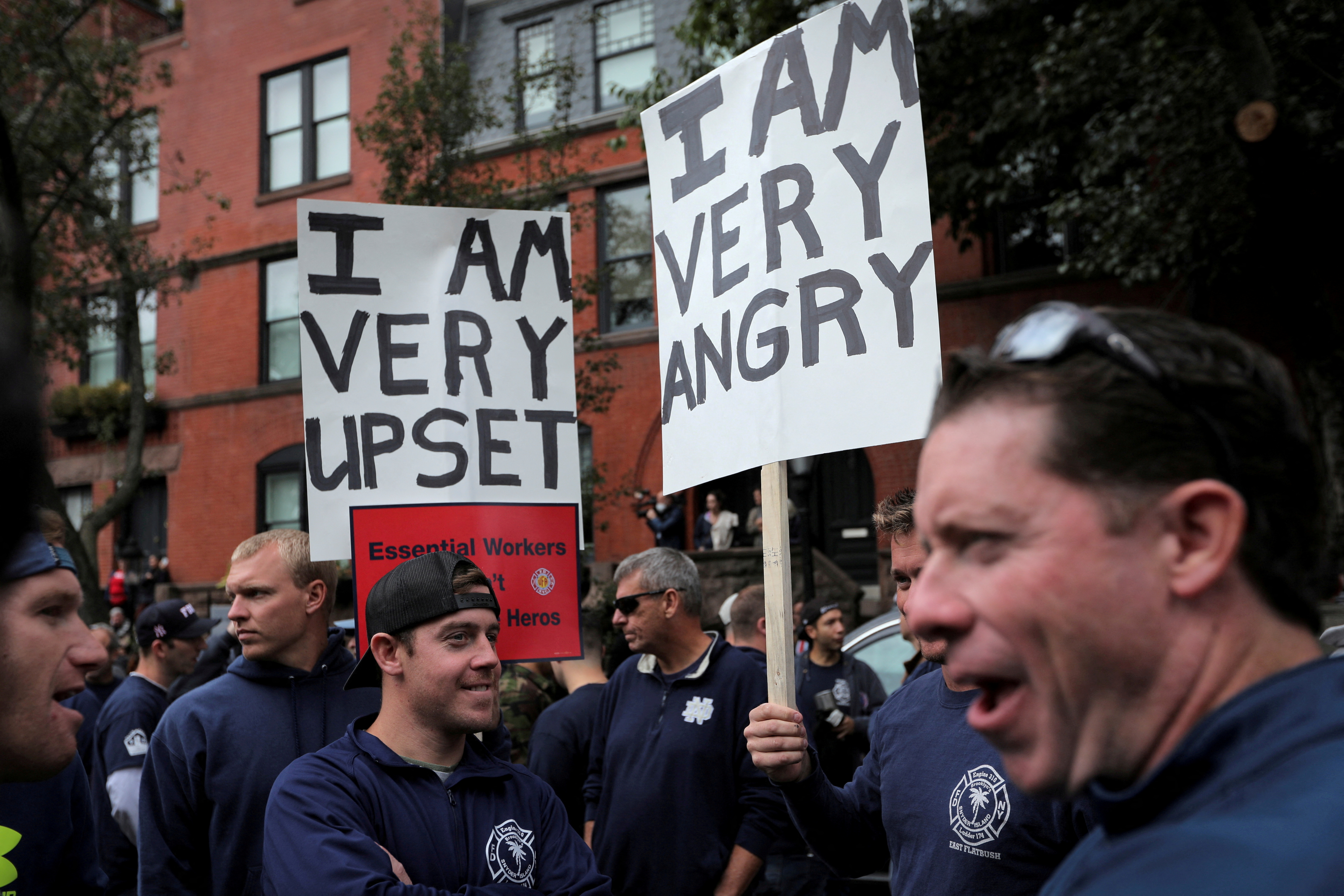 New York City Fire Department union members, municipal workers and others demonstrate during a protest against the city's Covid-19 vaccine mandates on Manhattan's Upper East Side in New York City, Oct. 28, 2021.