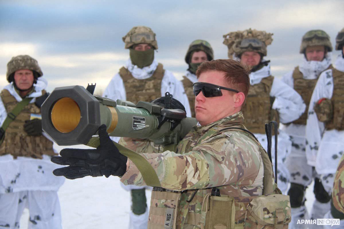U.S. army instructor from the Joint Multinational Training Group trains Ukrainian service members to operate with M141 Bunker Defeat Munition grenade launcher, supplied by the United States, at a shooting range in Lviv Region, Ukraine, in this handout picture released Jan. 30, 2022.
