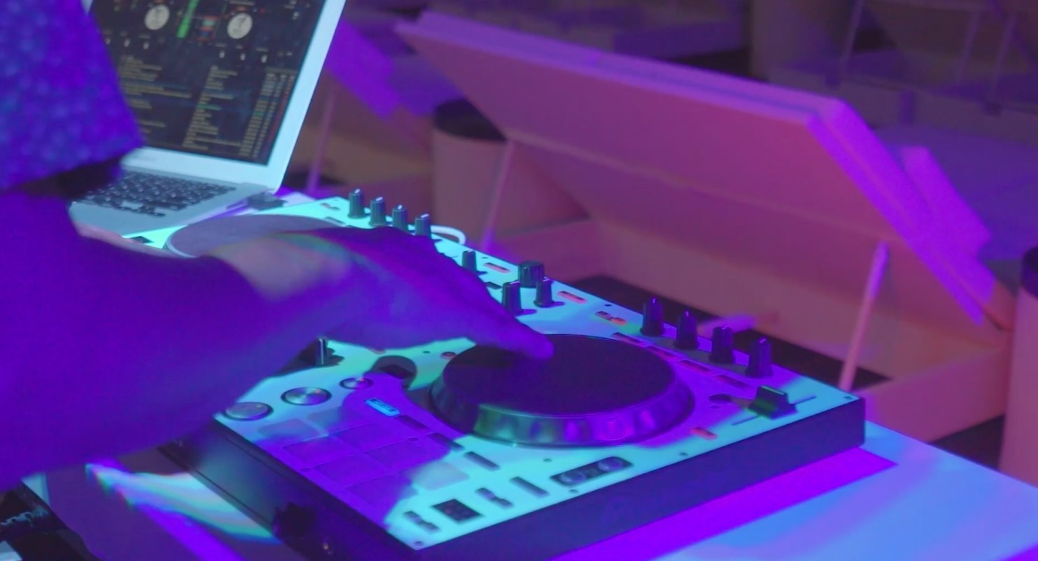 A DJ plays music at Kensington Hotel Saipan’s Infinity Pool.