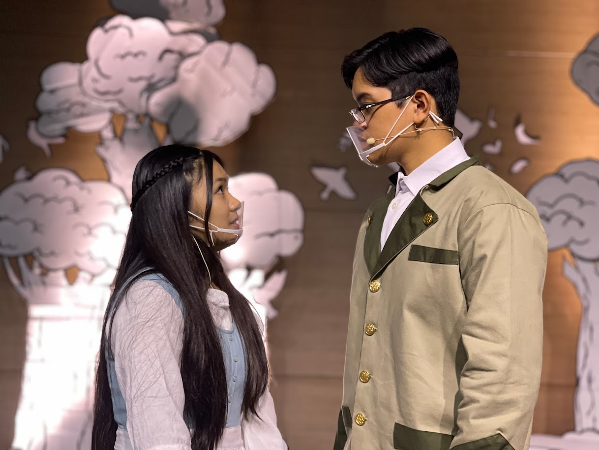 Captain George von Trapp, played by Manuel Pangelinan, and Maria, played by Bernice Sabino, share a heartfelt moment on stage.