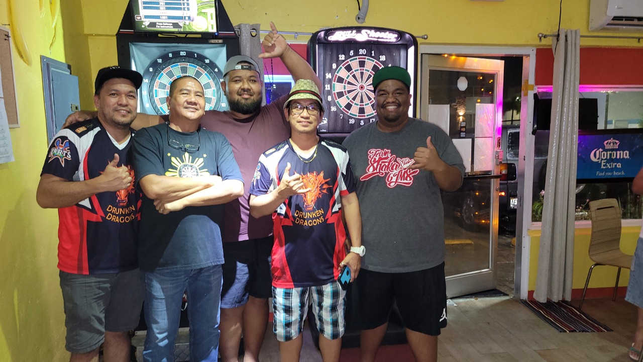 The 6JMS Drunken Dragons pose for a photo after winning a match in the SEDA Bud Light League A Division on Monday at Tambayan Resto Bar & Grill.