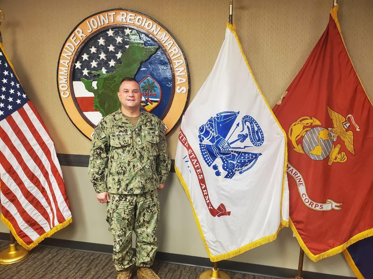 Rear Adm. Benjamin Nicholson, commander of Joint Region Marianas, poses for photos Tuesday after a media conference with Guam reporters.