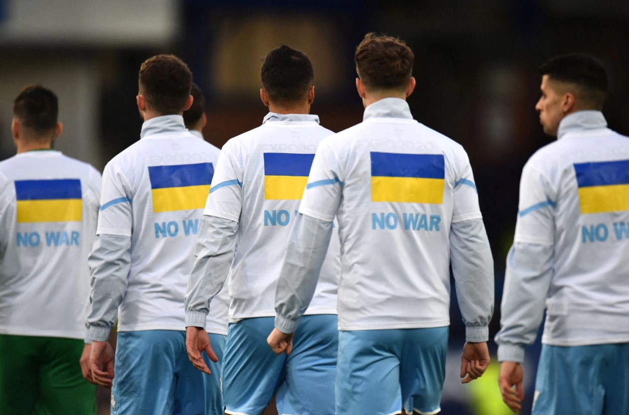 Manchester City players wear t-shirts in support of Ukraine before a soccer match at Goodison Park, Liverpool, Britain on Feb. 26, 2022.