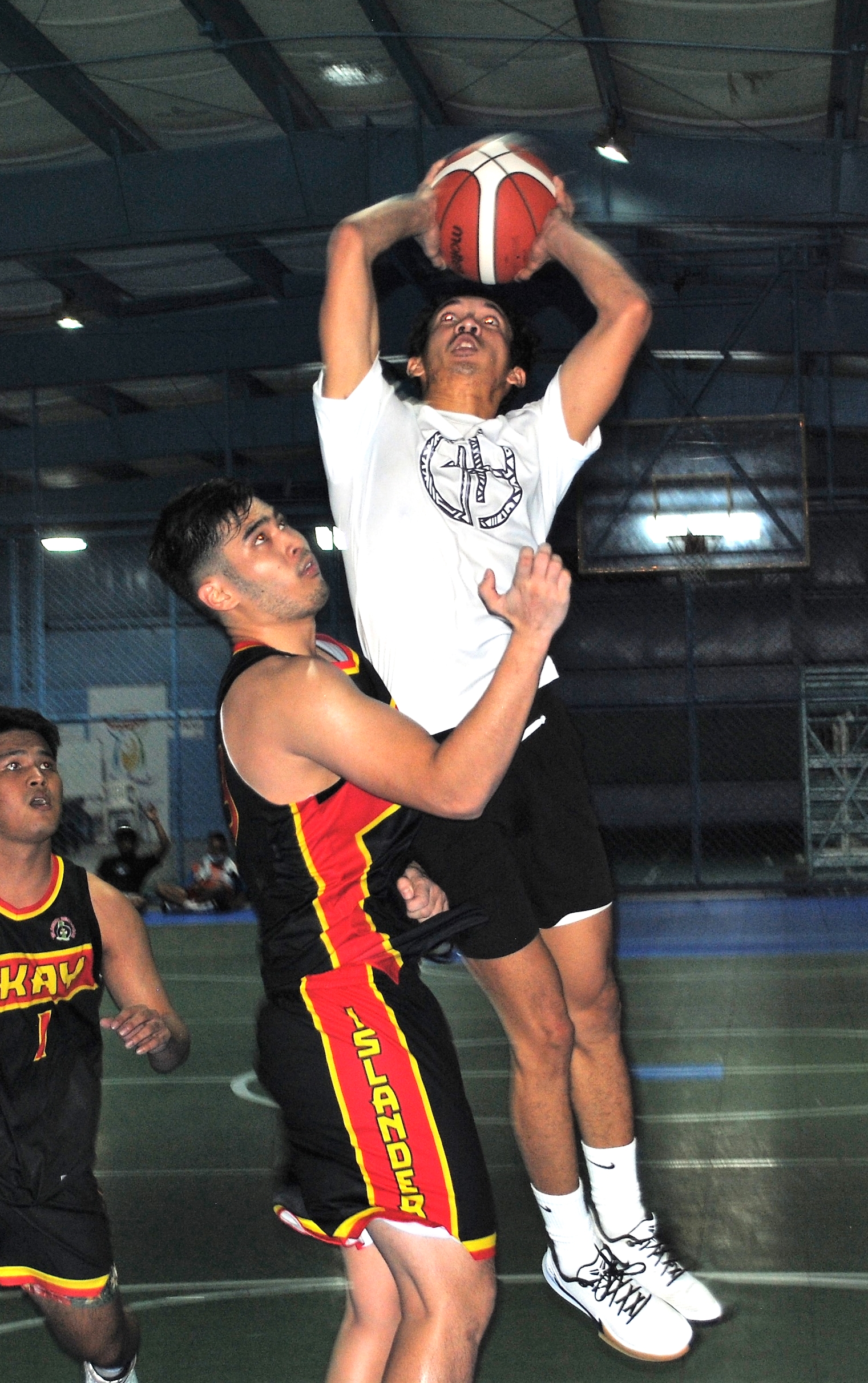 The Game's Mintac rises for the finish as he gets fouled during an Open Division game of the Saipan Centennial Lions Club Basketball League Saturday at the TSL Sports Complex.